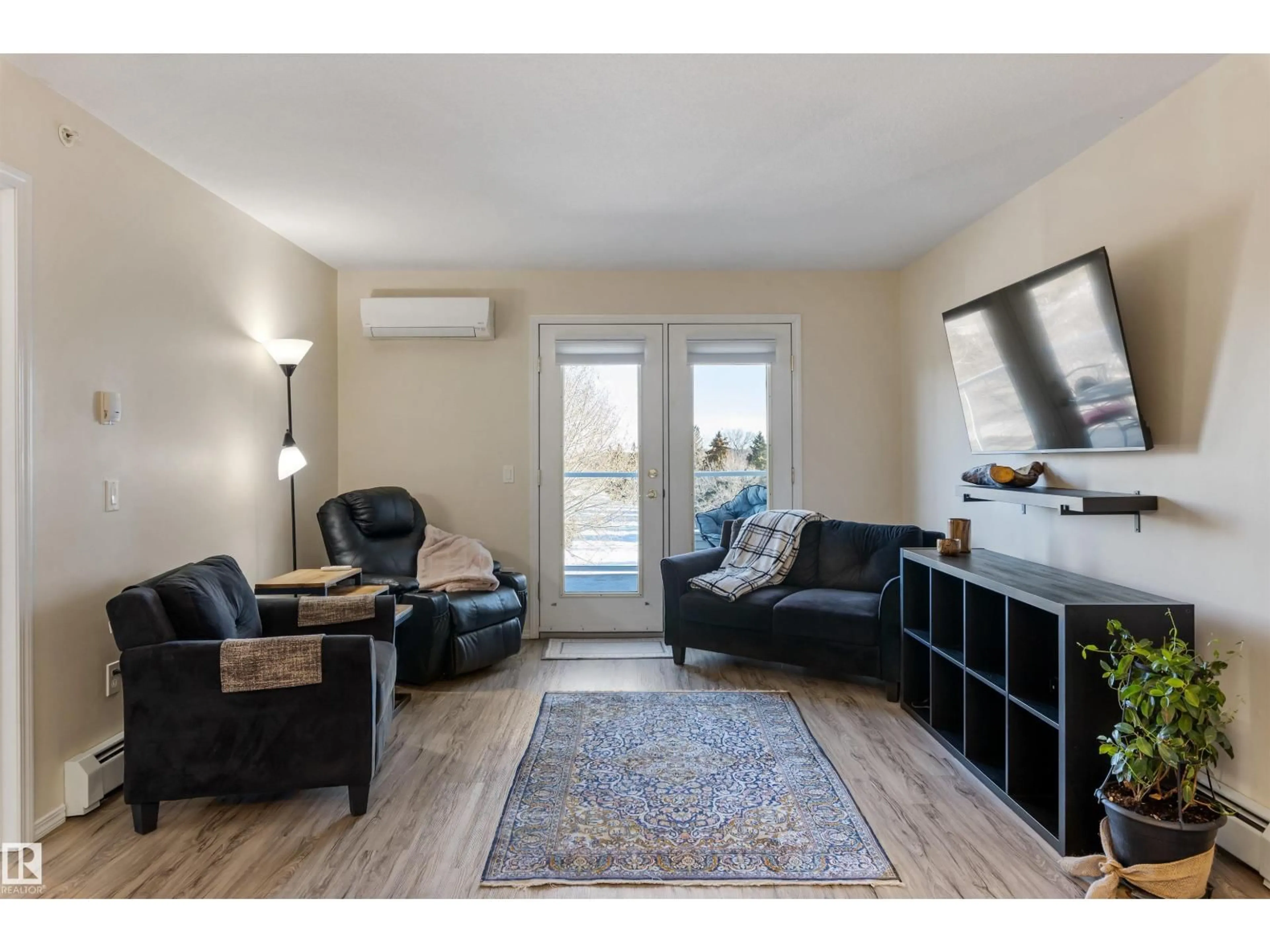 Living room with furniture, wood/laminate floor for #402 - 78 MCKENNEY AV, St. Albert Alberta T8N1L9