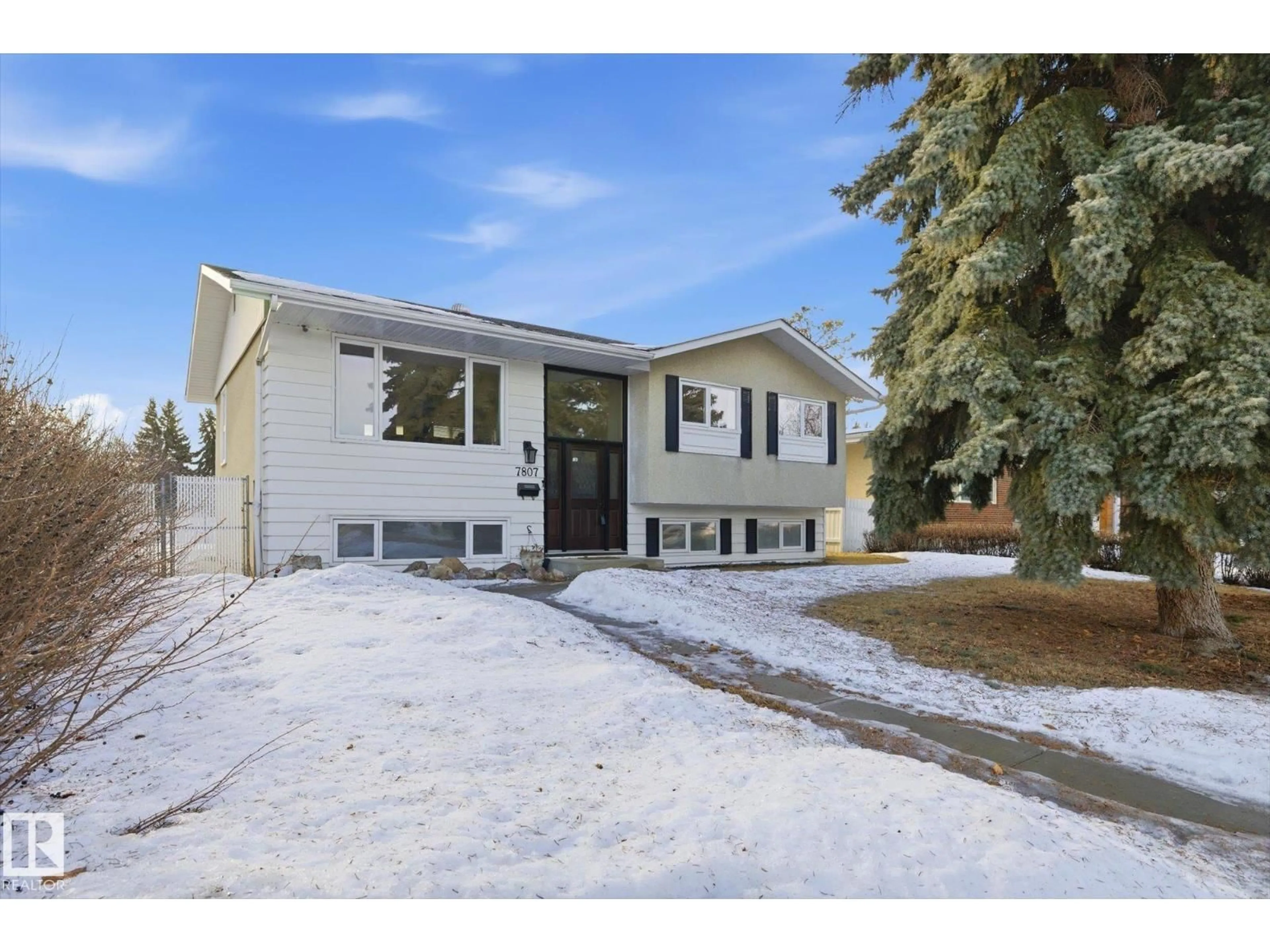 Home with vinyl exterior material, street for NW - 7807 145 AV, Edmonton Alberta T5C2S5