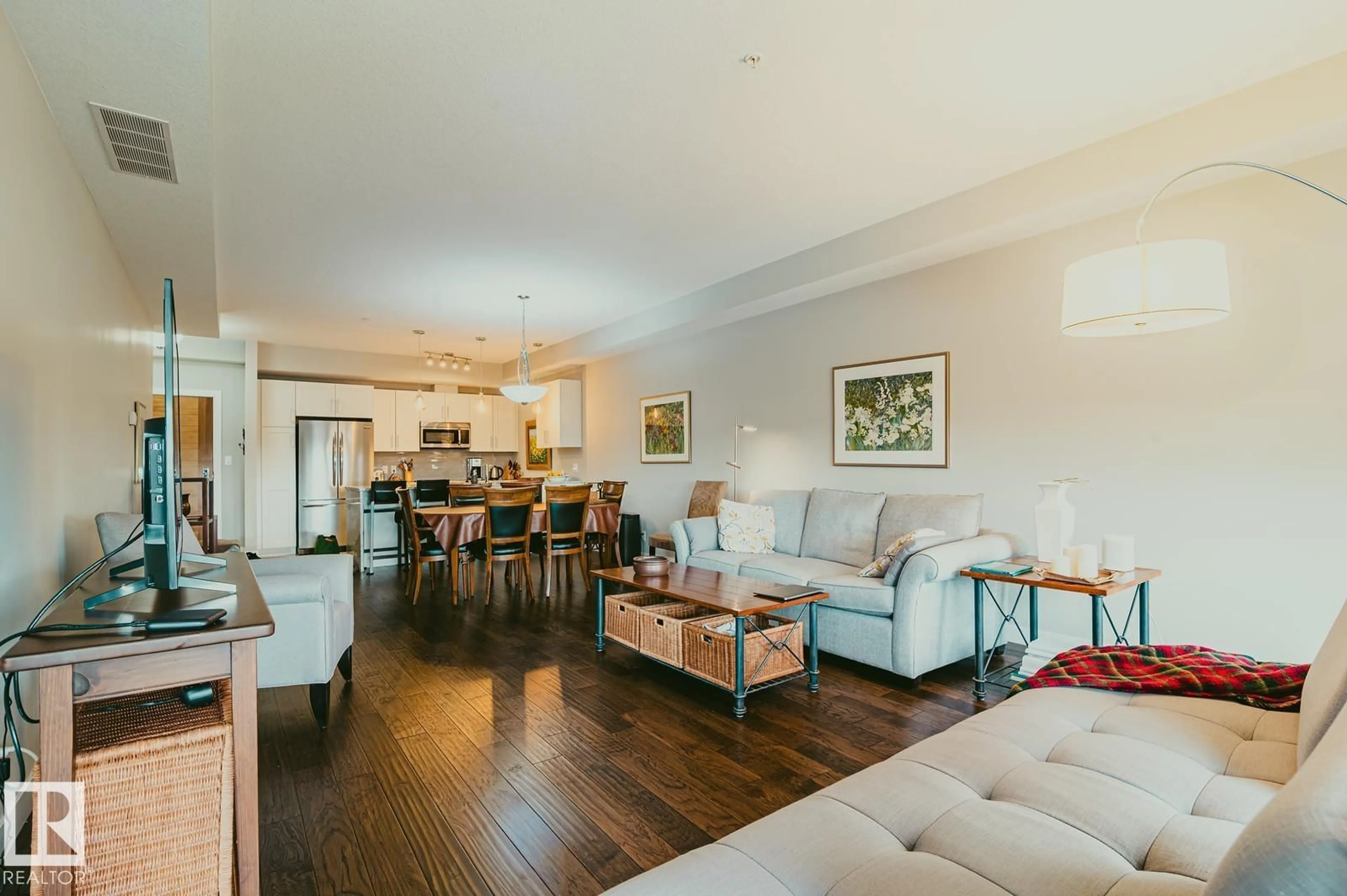 Living room with furniture, wood/laminate floor for 301 - 301 LEGER WY, Edmonton Alberta T6R0W4