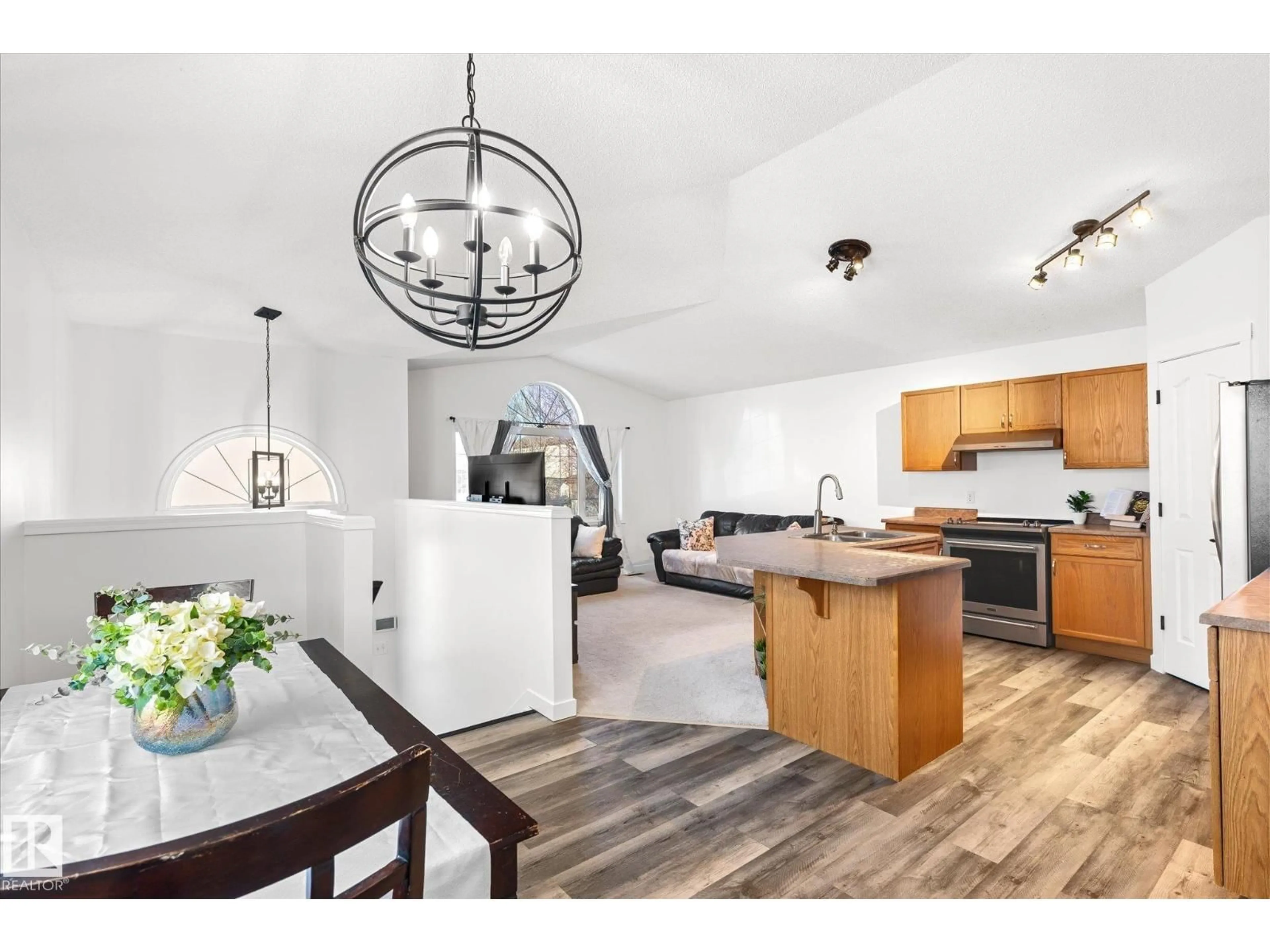 Open concept kitchen, wood/laminate floor for 3015 49, Beaumont Alberta T4X1S6