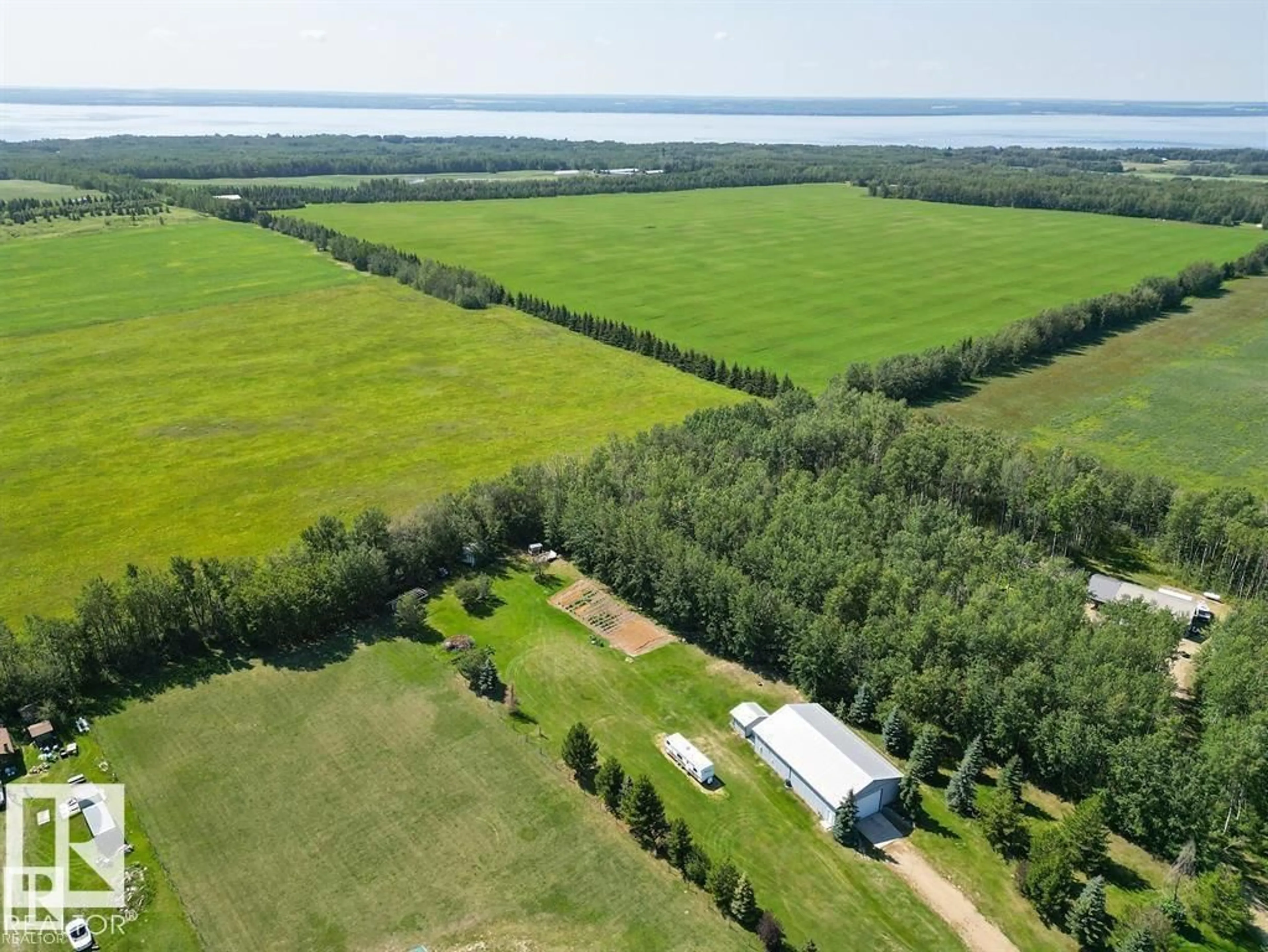 A pic from outside/outdoor area/front of a property/back of a property/a pic from drone, forest/trees view for 45A RGE ROAD 11, Rural Wetaskiwin County Alberta T0C2P0