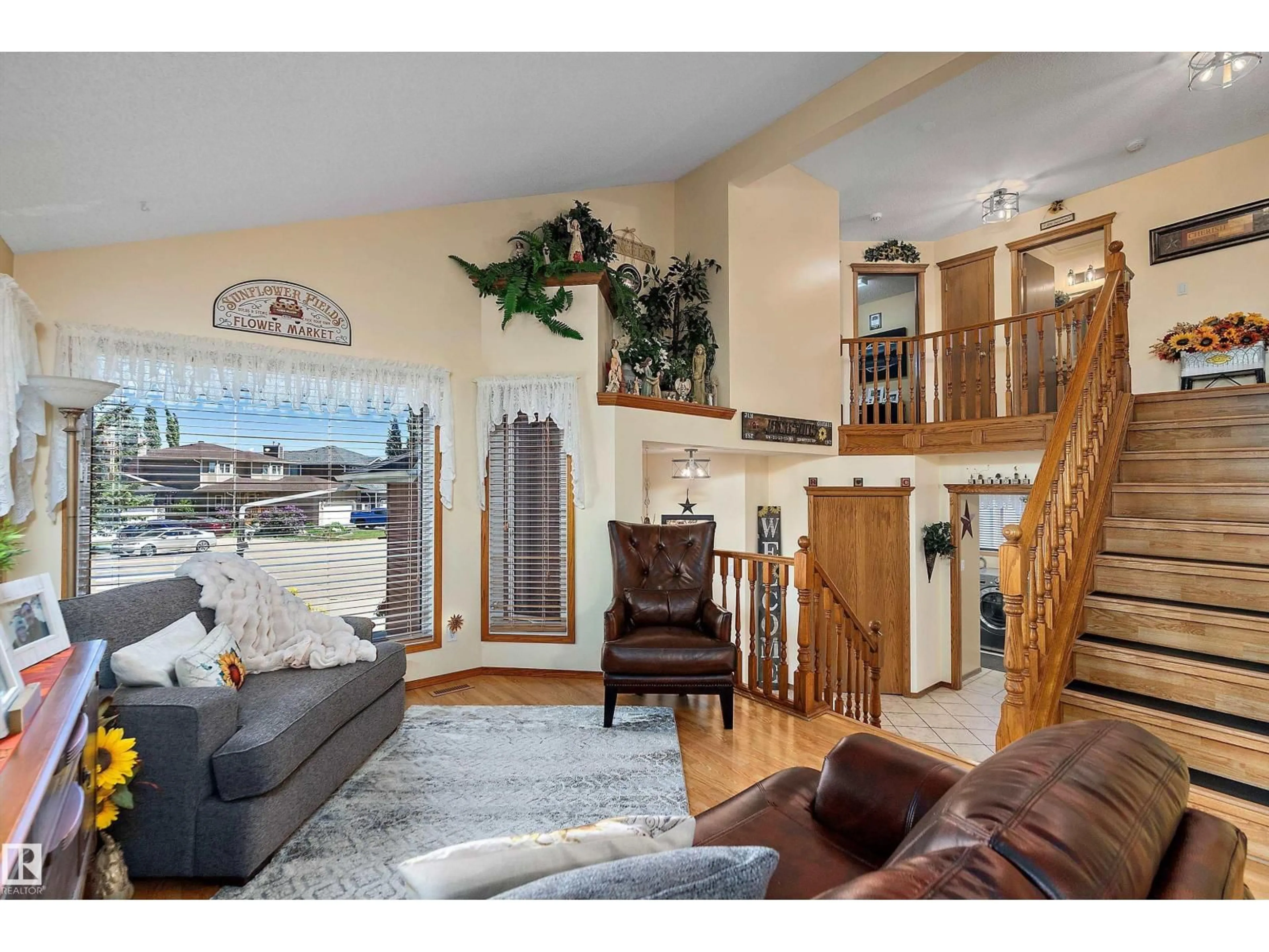 Living room with furniture, wood/laminate floor for 204 WEST LIBERTY CR, Millet Alberta T0C1Z0