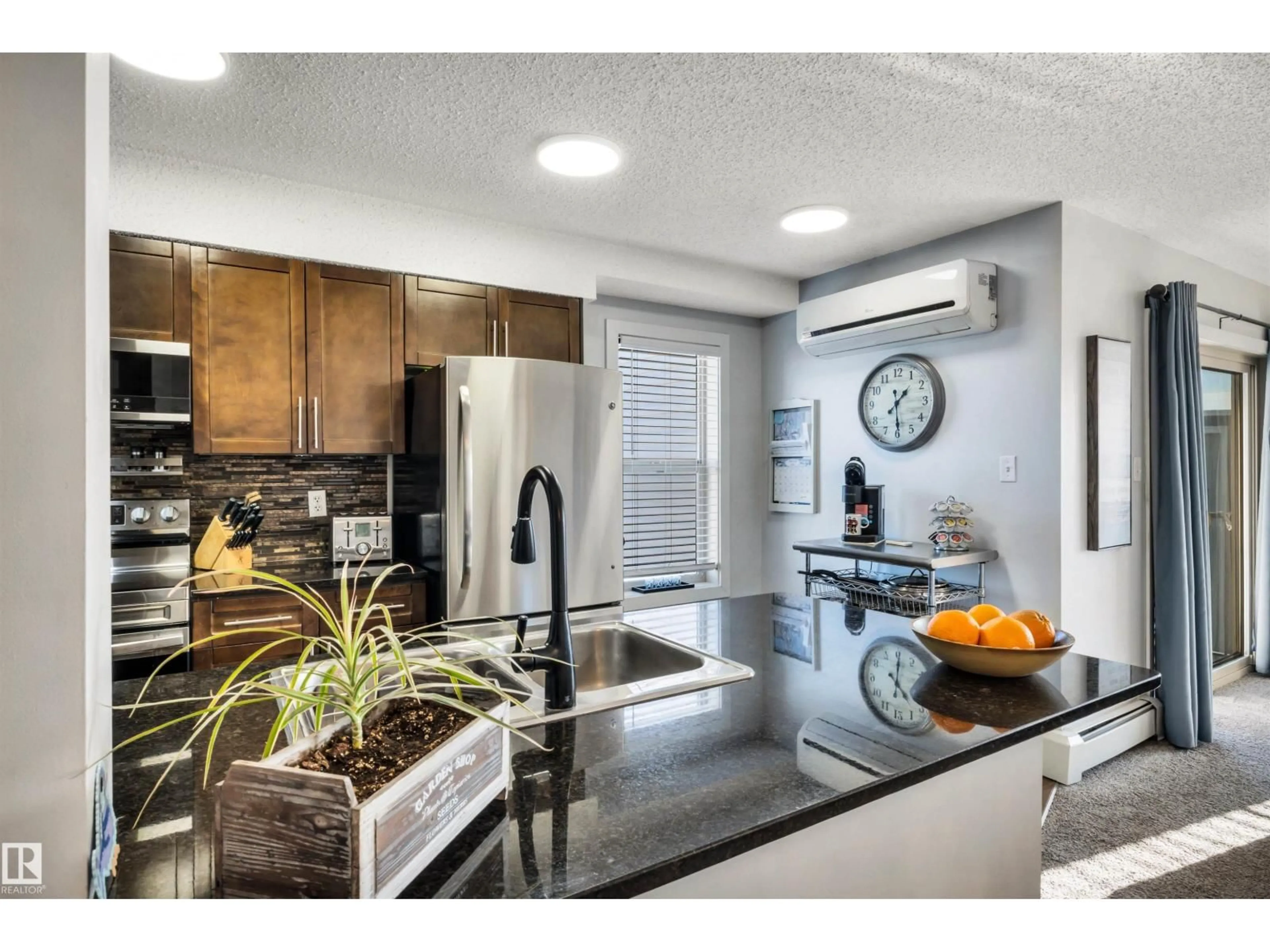 Open concept kitchen, ceramic/tile floor for 415 11816 22 AV SW, Edmonton Alberta T6W2A2