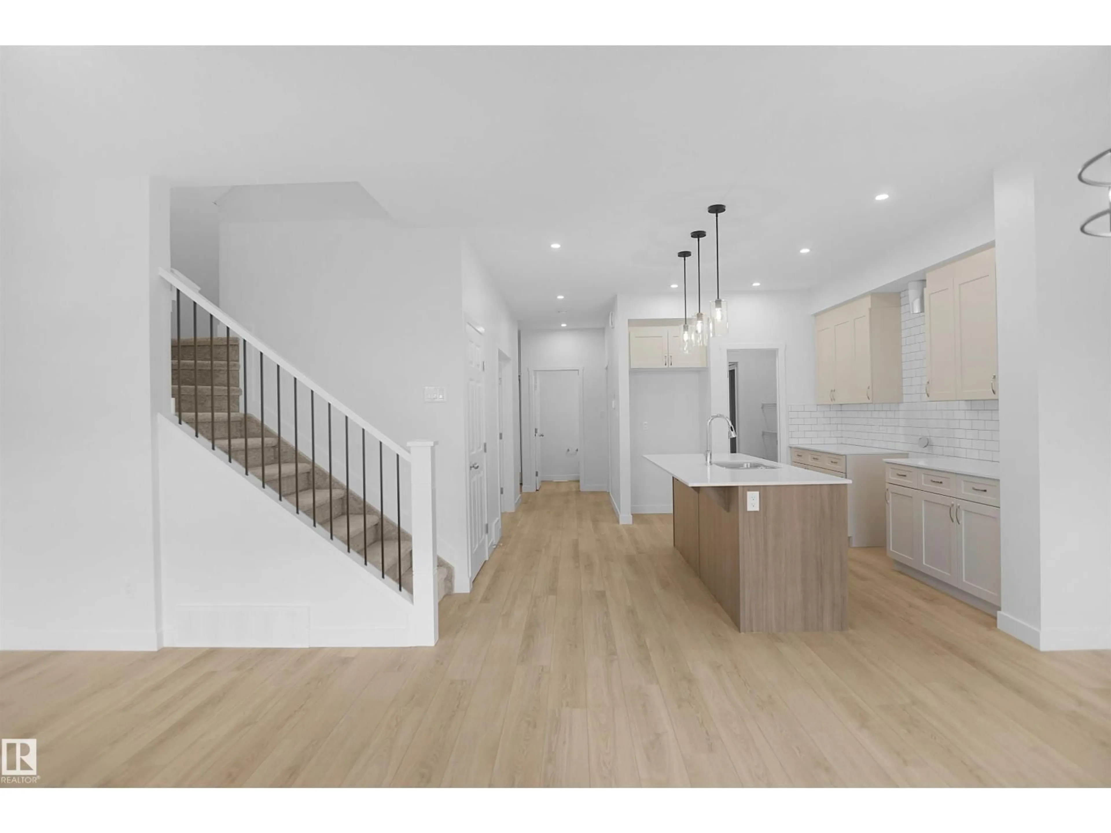 Open concept kitchen, wood/laminate floor for NW - 2270 194A ST, Edmonton Alberta T6M3B6