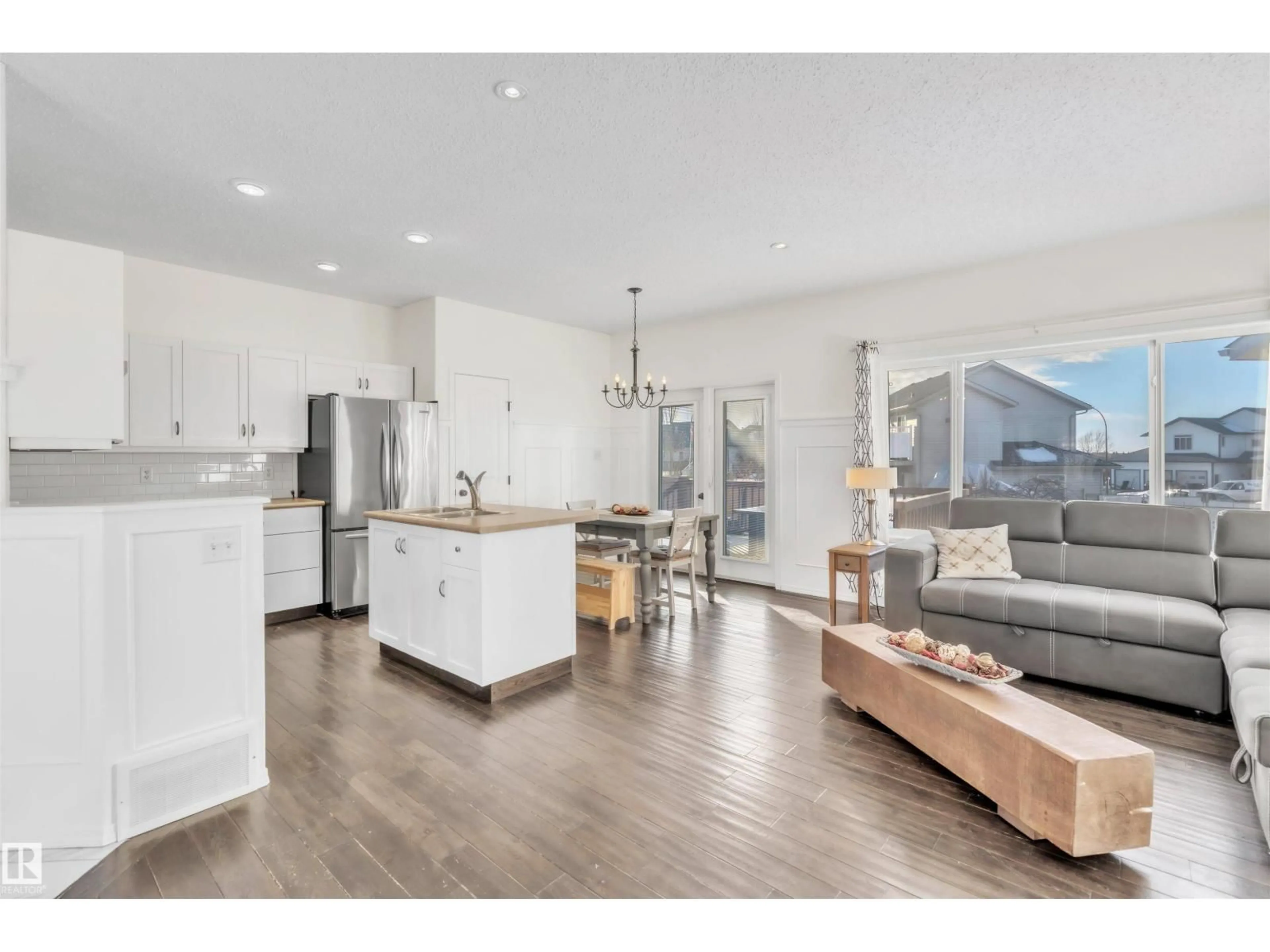 Open concept kitchen, wood/laminate floor for 701 SPARROW CL, Cold Lake Alberta T9M2B7