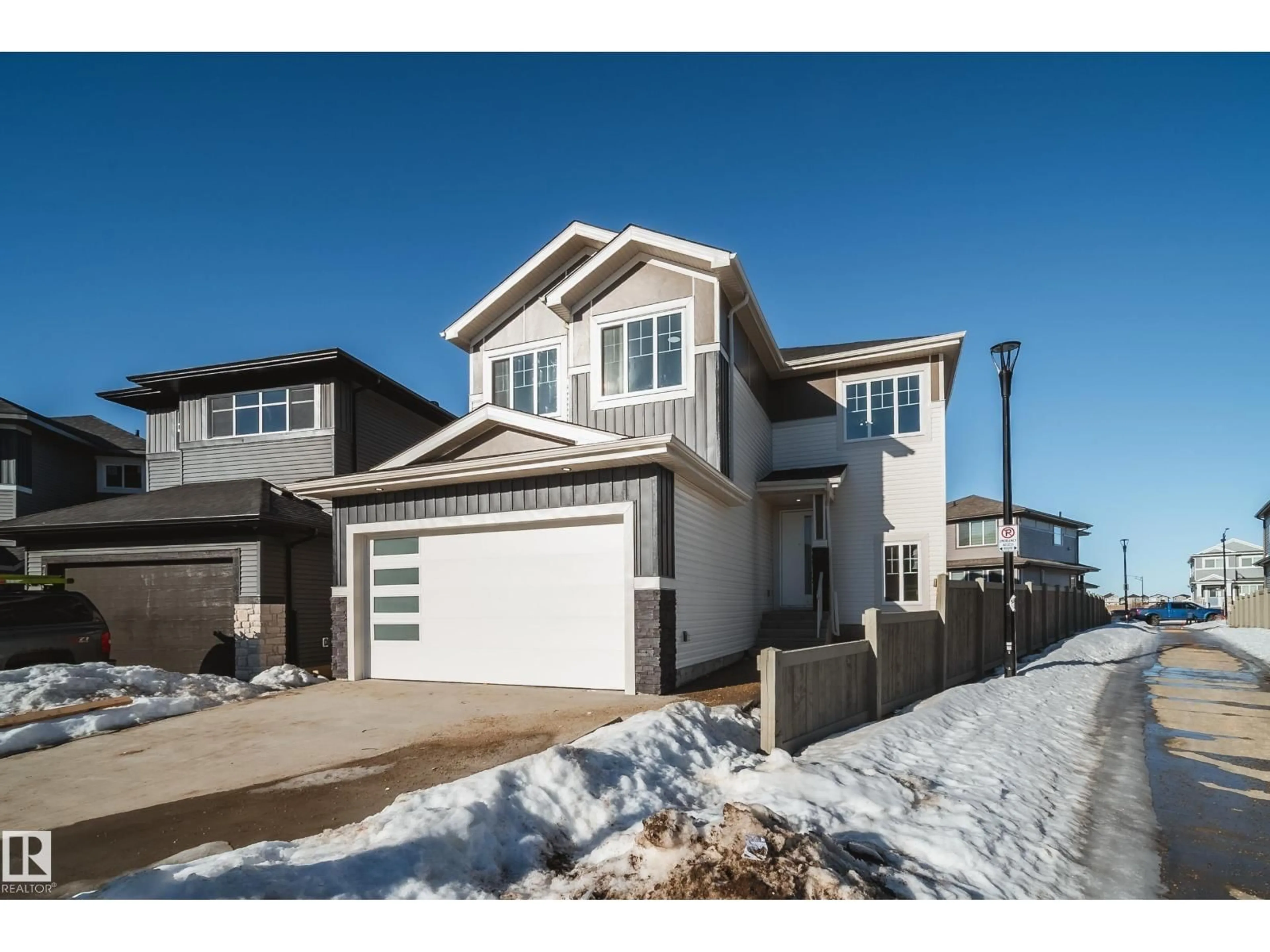 Home with vinyl exterior material, street for NW - 7156 177 AV, Edmonton Alberta T5Z0W9