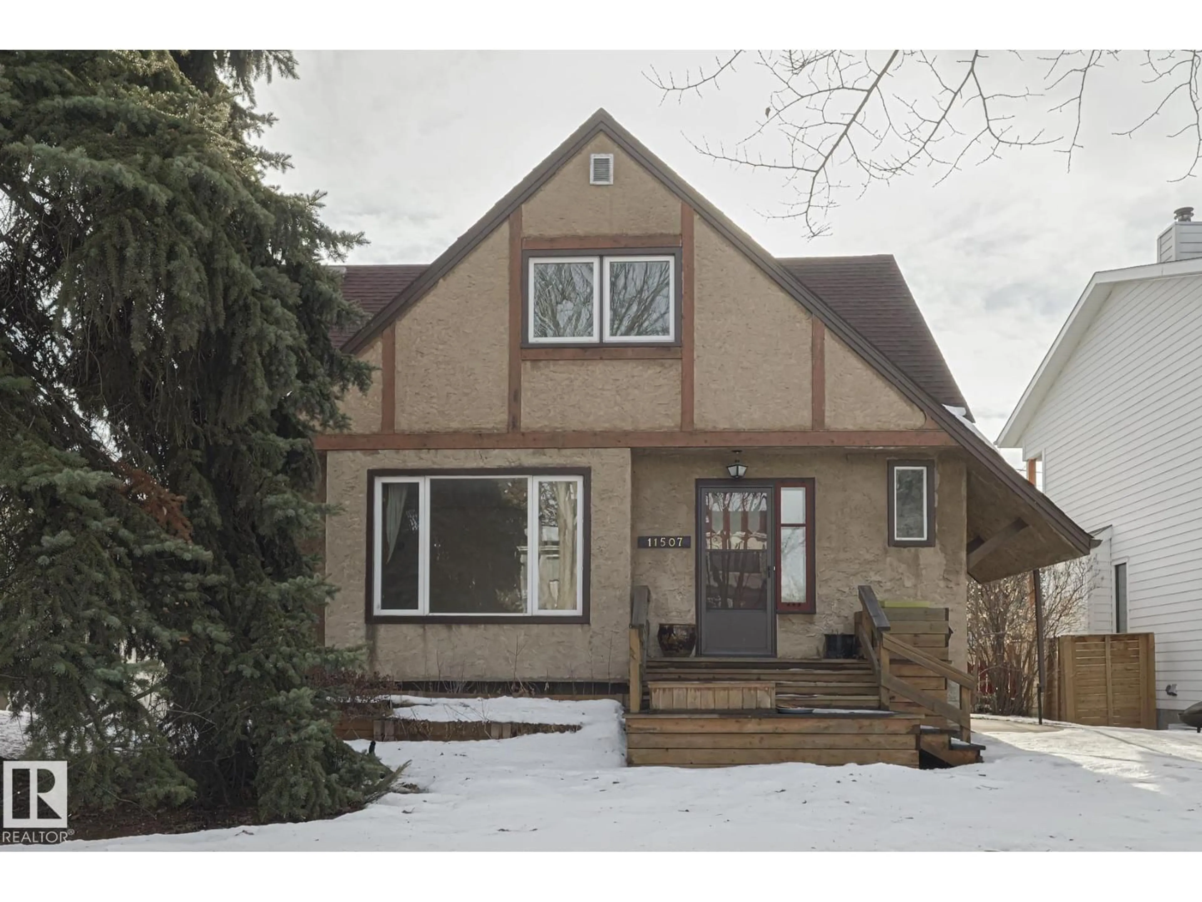 Home with vinyl exterior material, street for 11507 72 AV, Edmonton Alberta T6G0B7