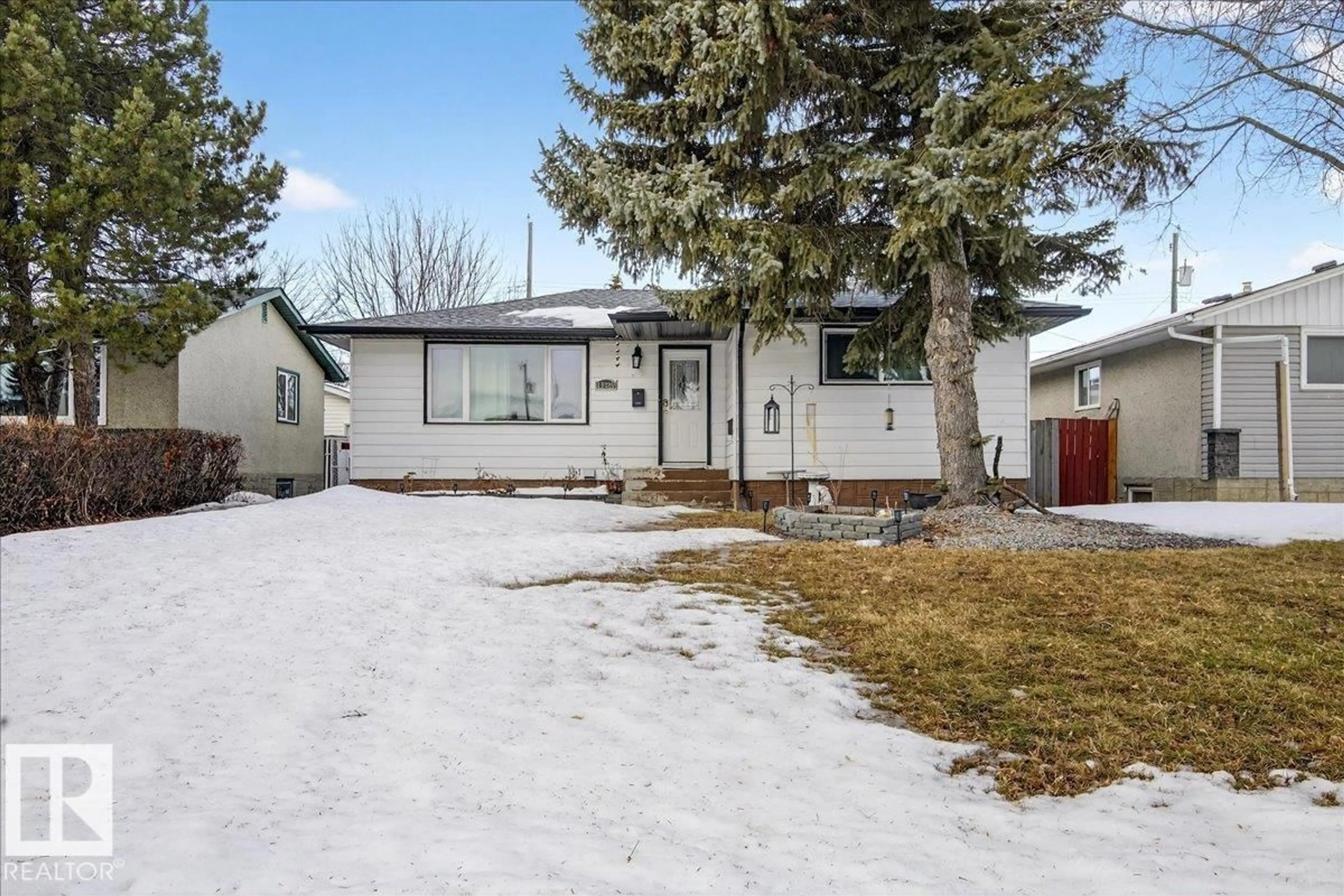 Home with vinyl exterior material, street for 13320 123 ST, Edmonton Alberta T5L0L9