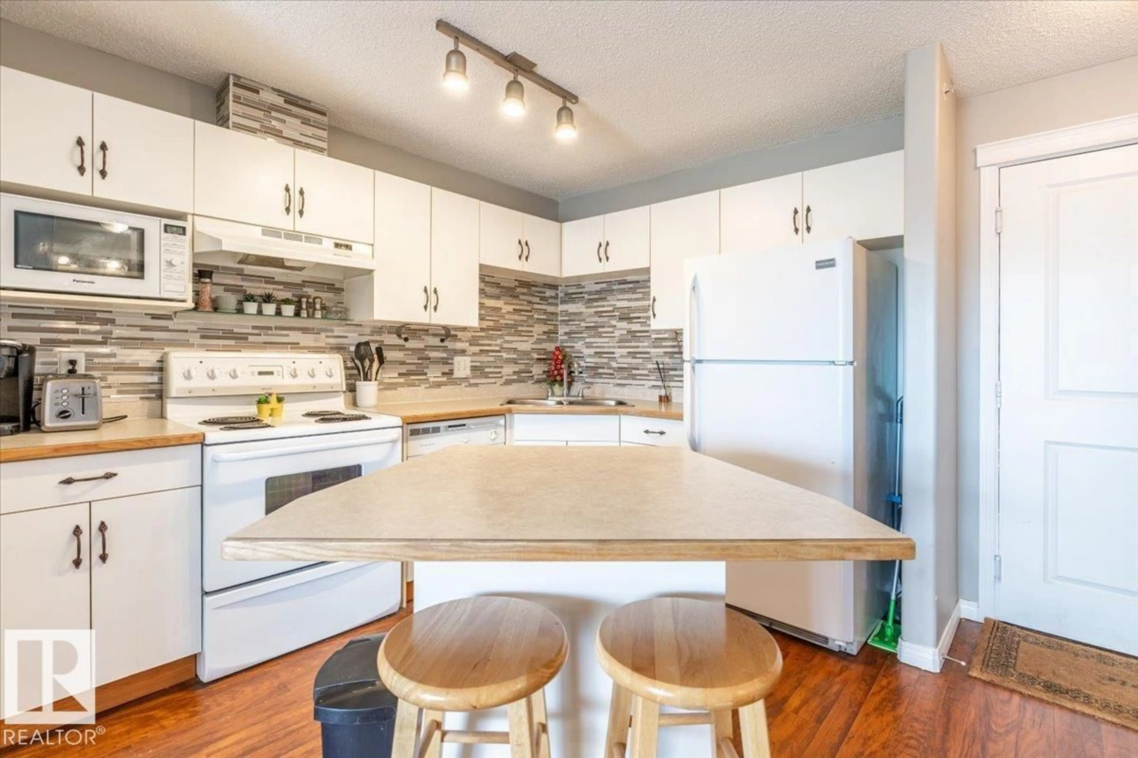 Open concept kitchen, wood/laminate floor for 523 10535 122 ST NW, Edmonton Alberta T5N4B7