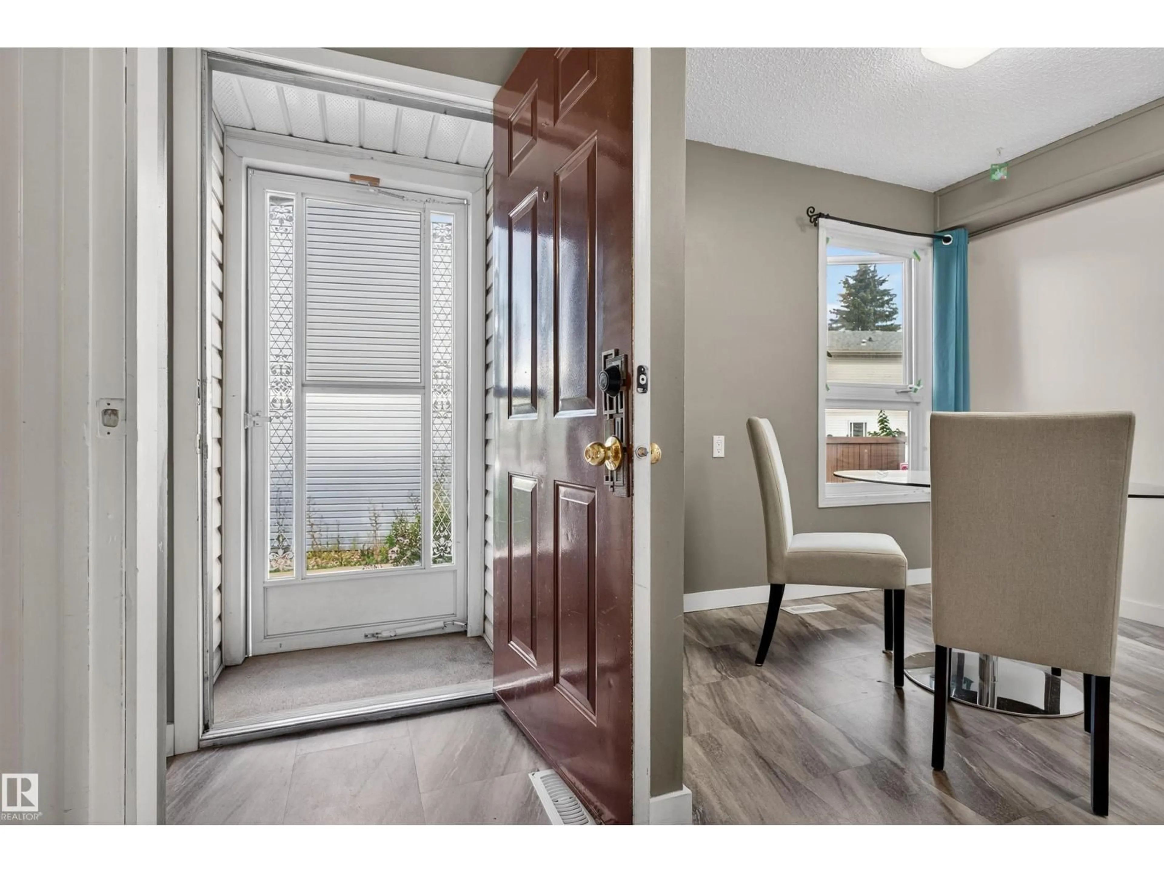 Indoor entryway for 14017 121 ST, Edmonton Alberta T5X4H8