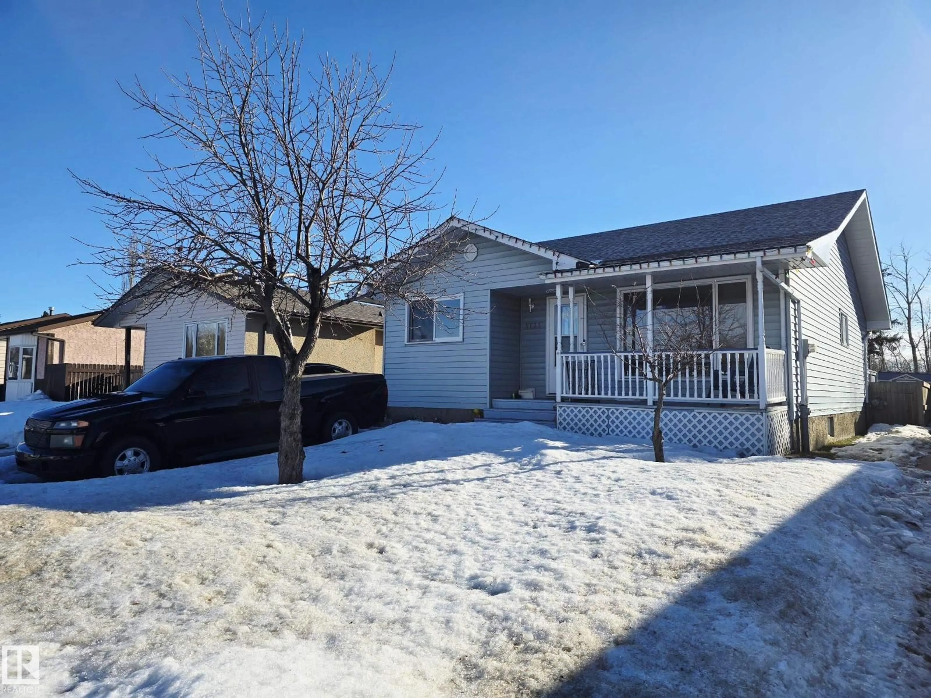 A pic from outside/outdoor area/front of a property/back of a property/a pic from drone, street for 5835 10 AV NW, Edmonton Alberta T6L3A5
