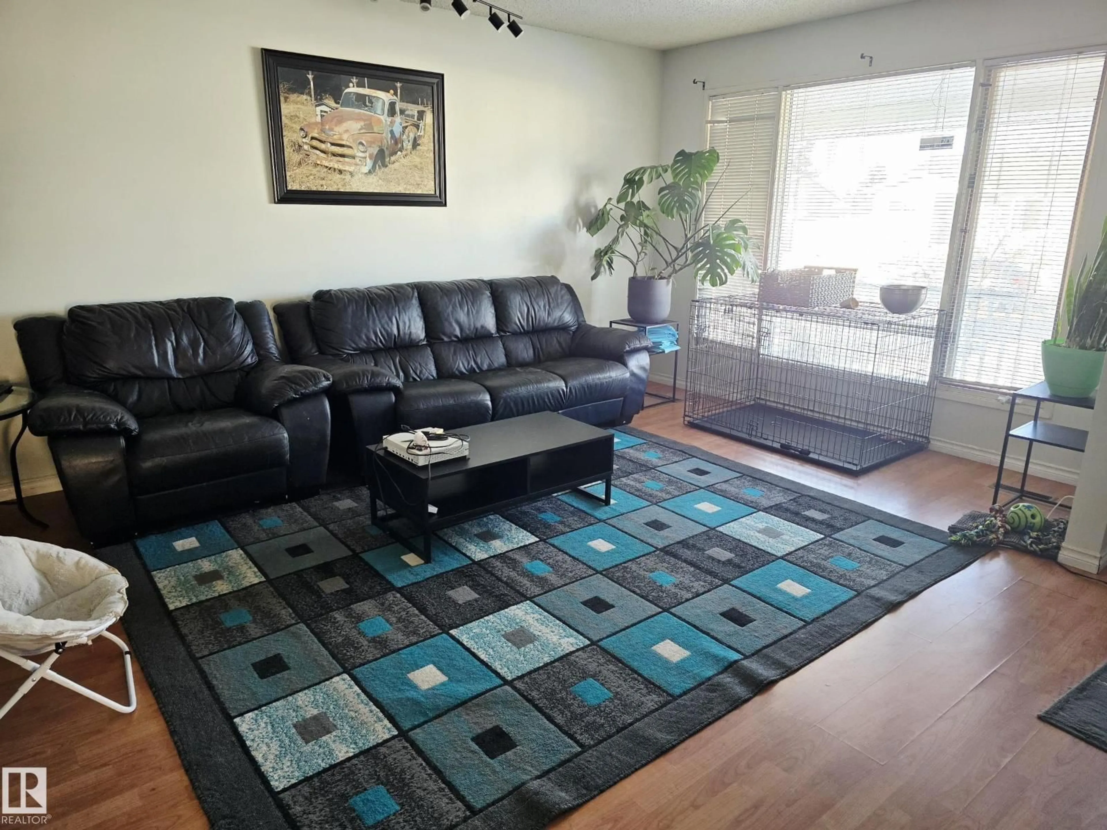Living room with furniture, unknown for 5835 10 AV NW, Edmonton Alberta T6L3A5