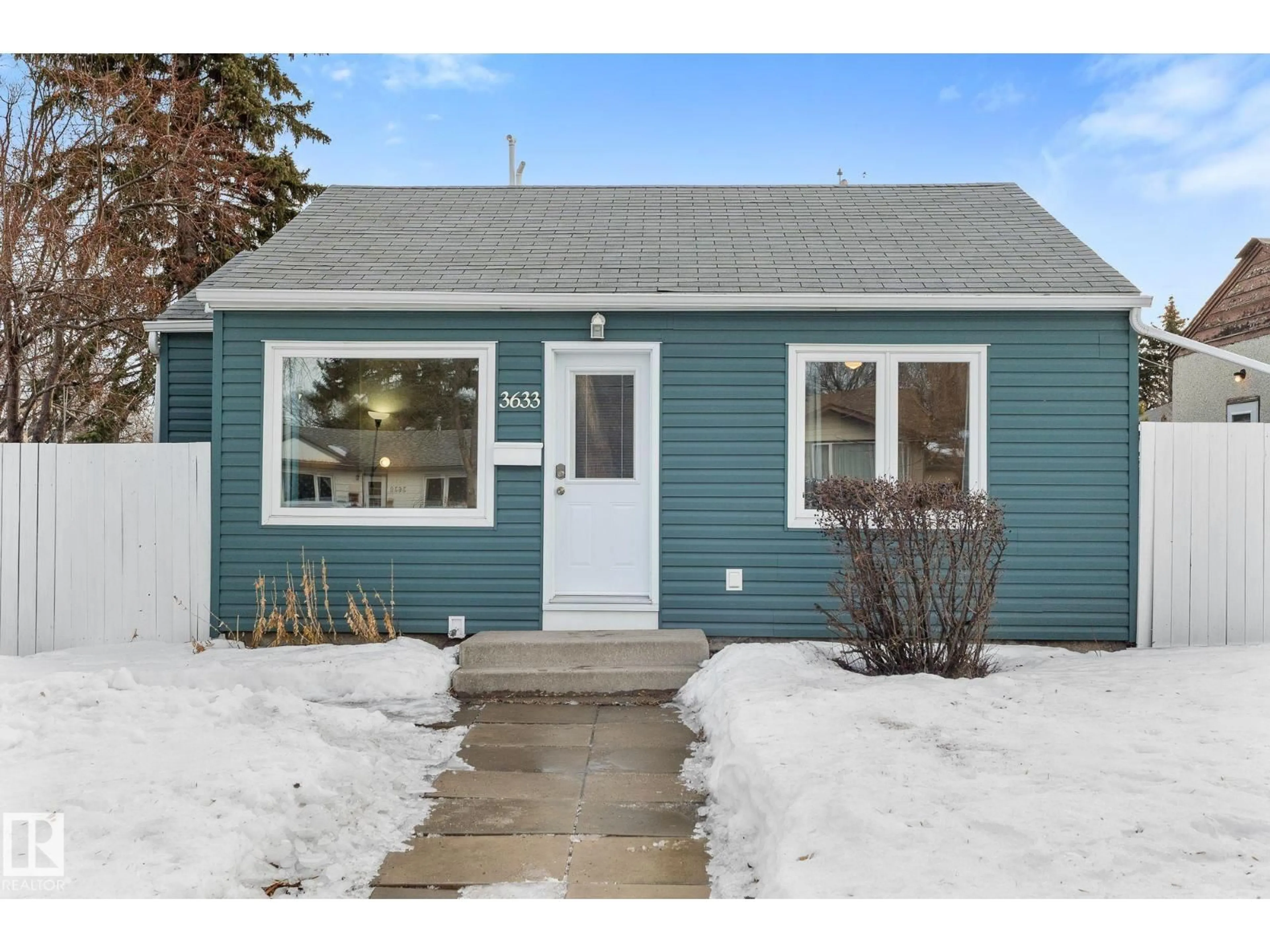 Home with vinyl exterior material, street for 3633 106 AV, Edmonton Alberta T5W0C4