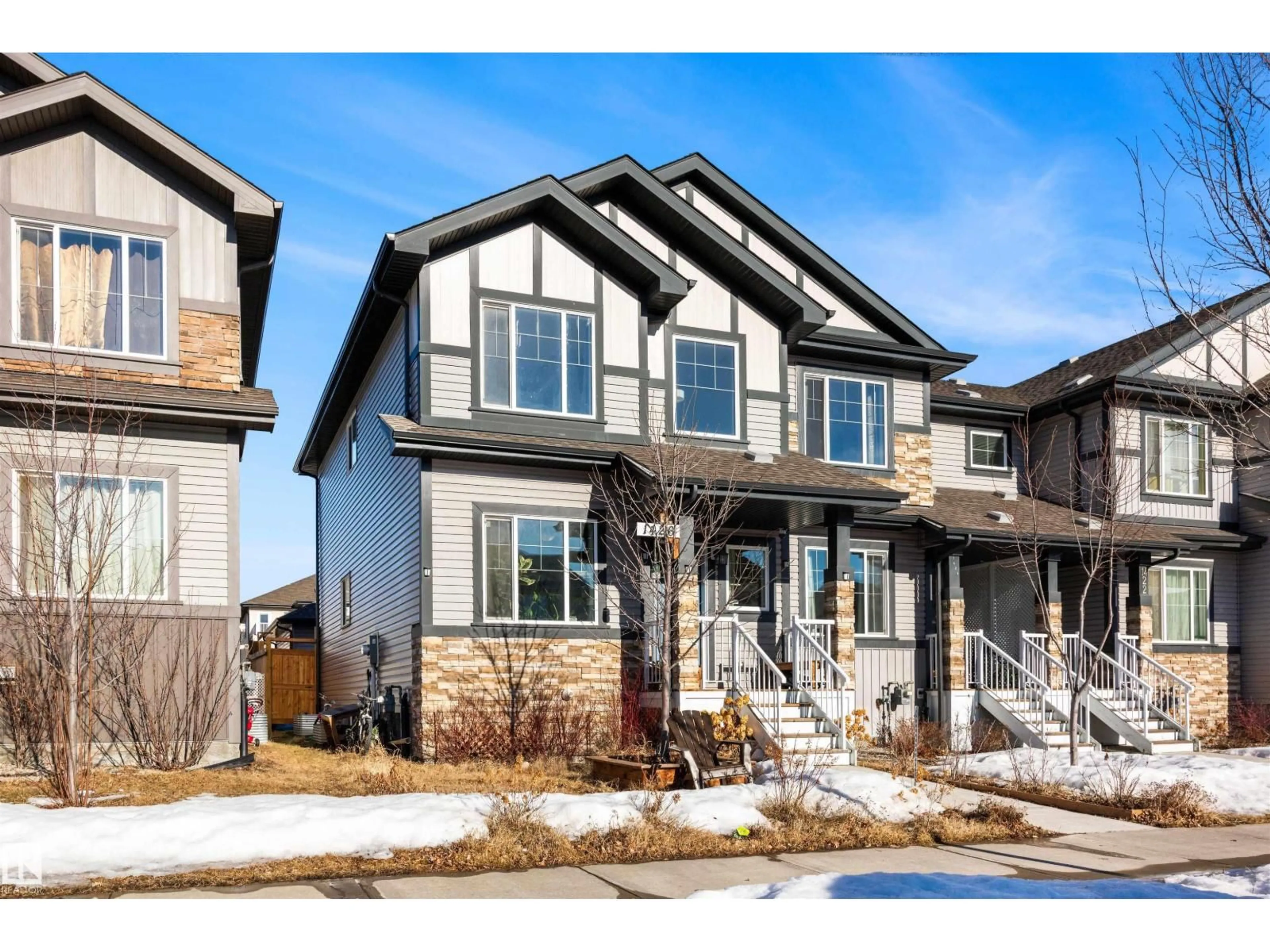 Home with vinyl exterior material, street for 1426 26 AV, Edmonton Alberta T6T0W1