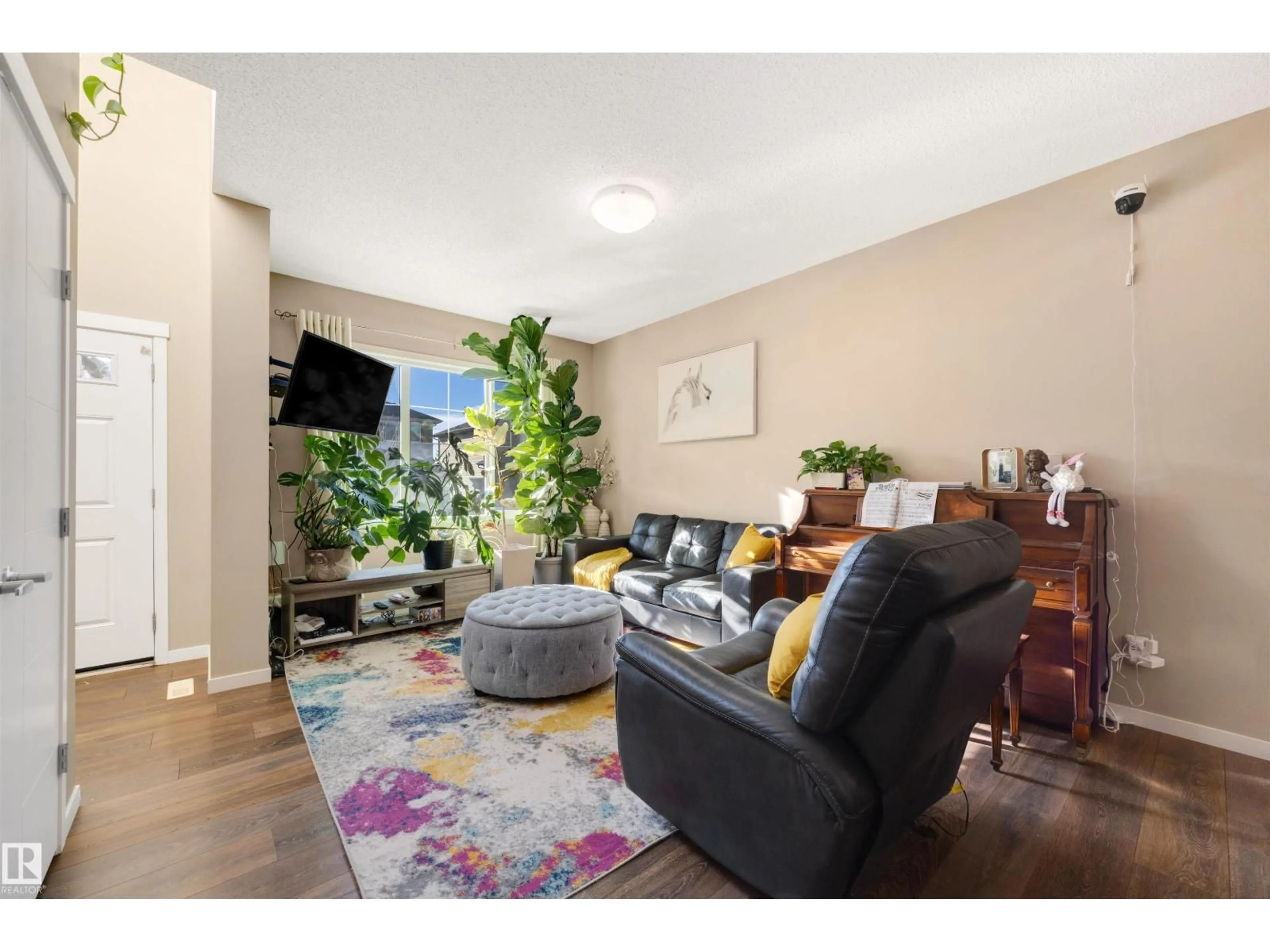 Living room with furniture, unknown for 1426 26 AV, Edmonton Alberta T6T0W1