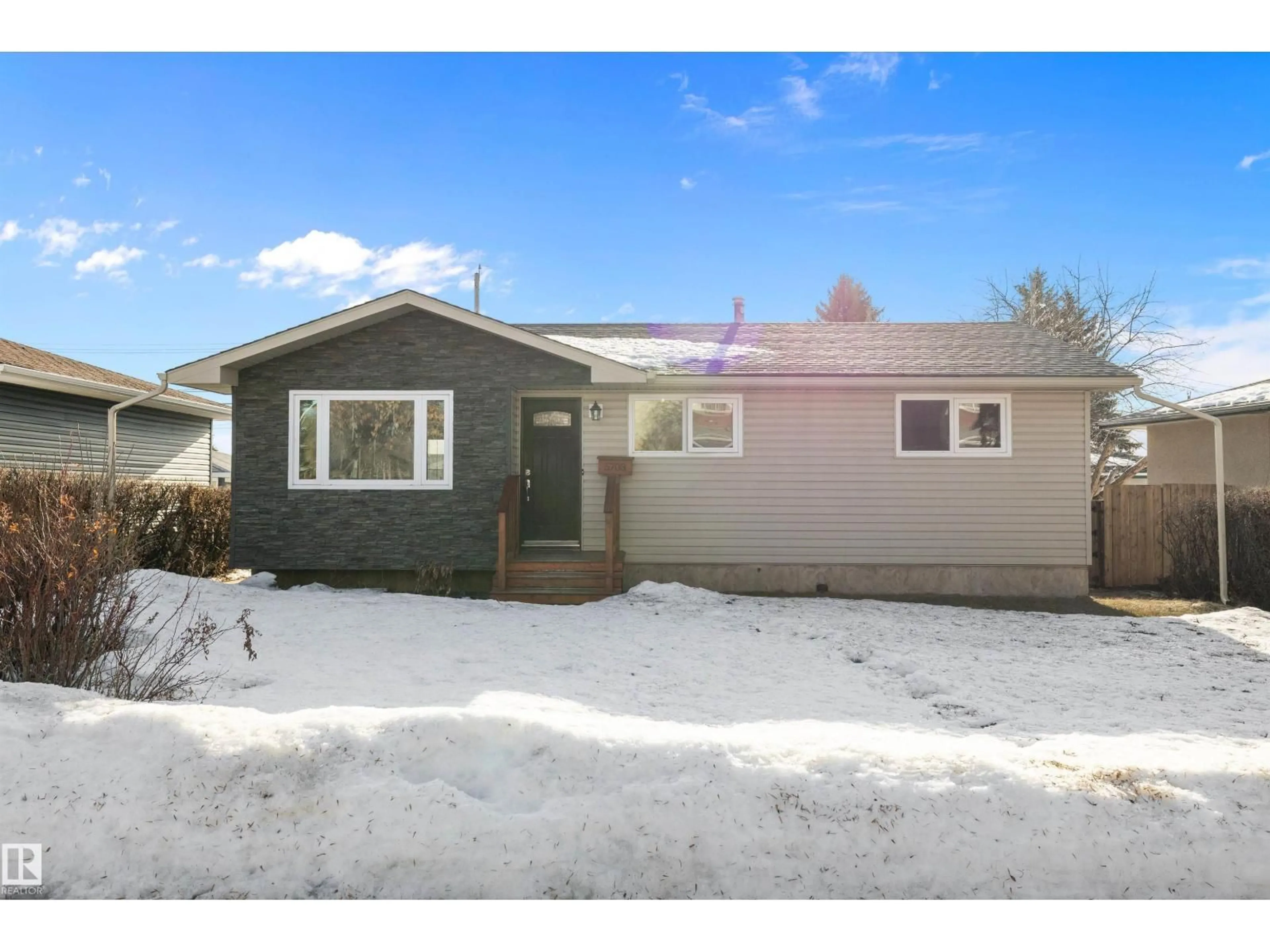 Home with vinyl exterior material, street for 5703 143 AV, Edmonton Alberta T5A1J9
