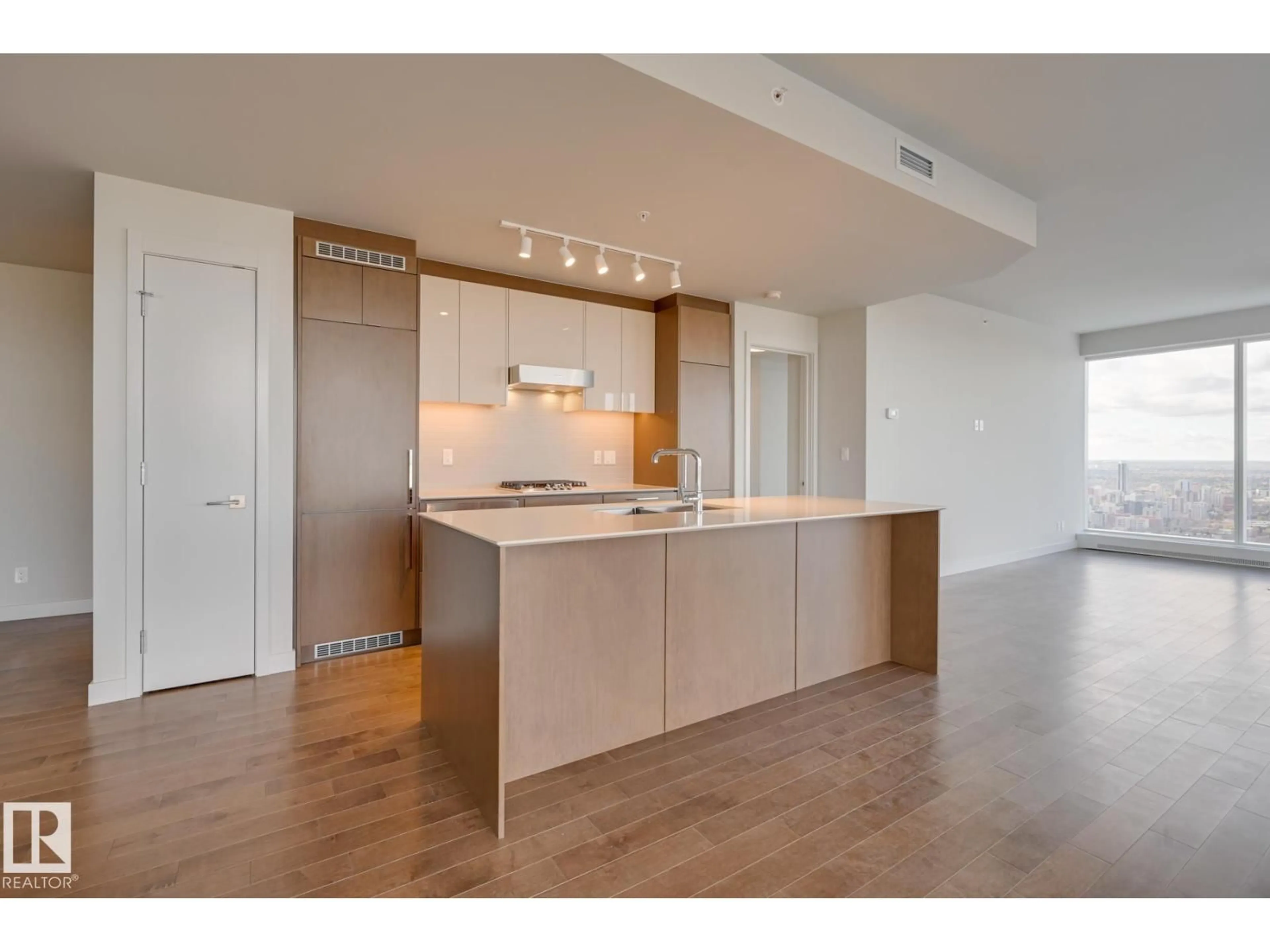 Open concept kitchen, wood/laminate floor for 3901 10360 102 ST NW, Edmonton Alberta T5J0K6