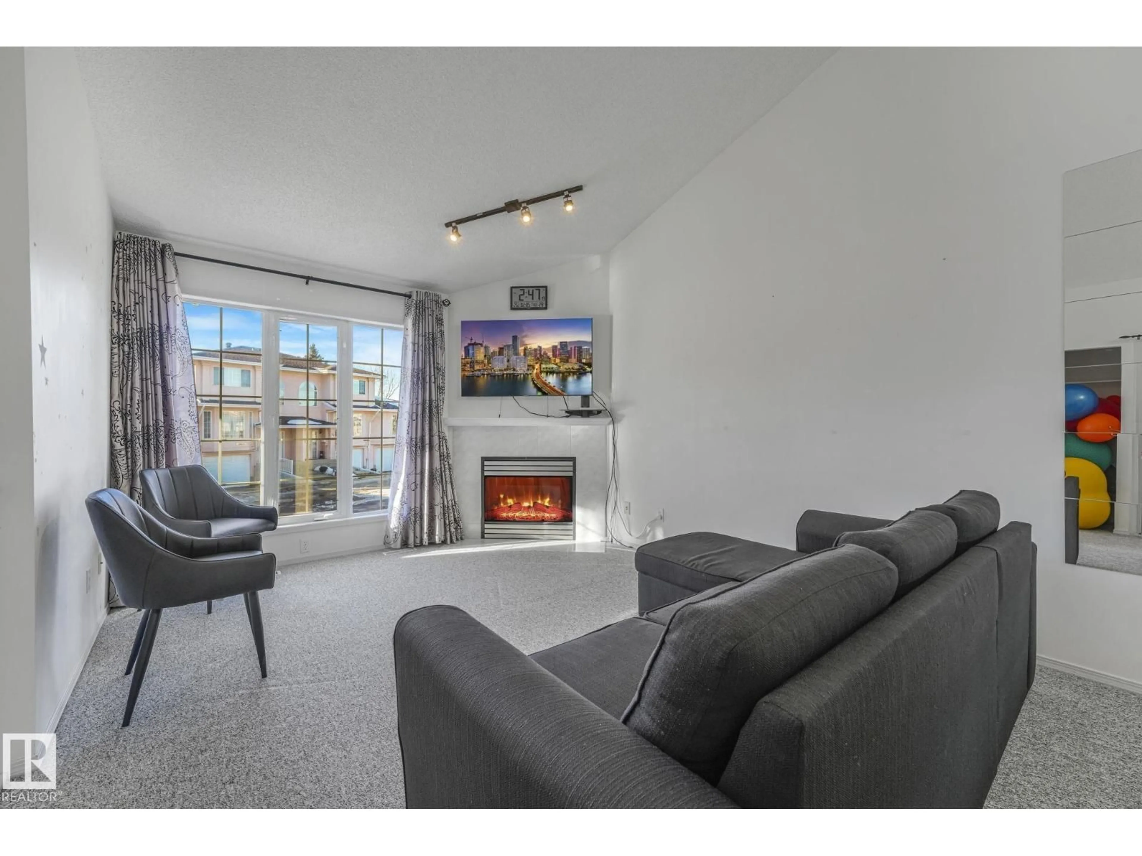 Living room with furniture, unknown for 11105 9 AV, Edmonton Alberta T6J6Z4