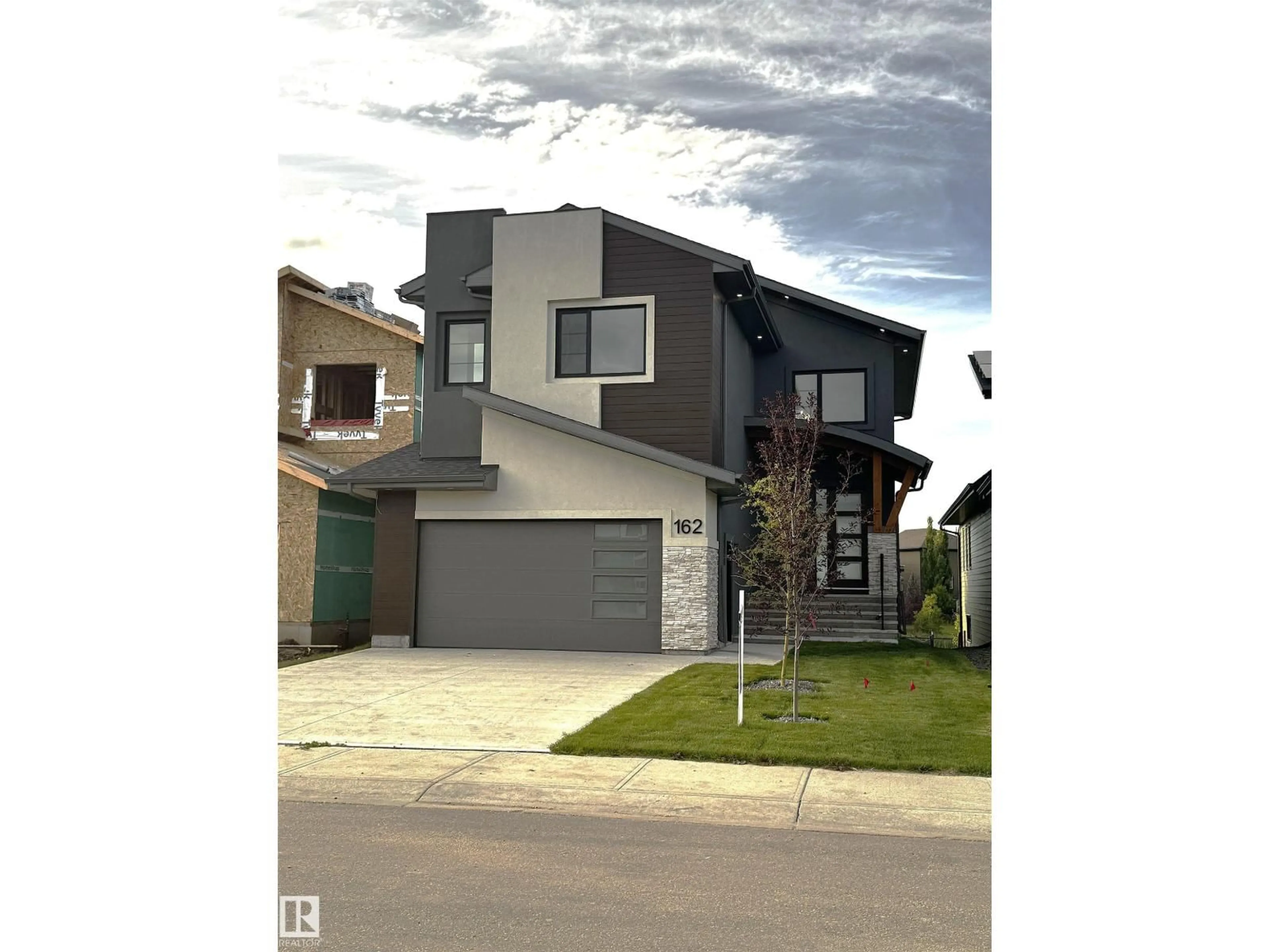 Home with vinyl exterior material, street for 162 EDGEWATER CI, Leduc Alberta T9E1K5