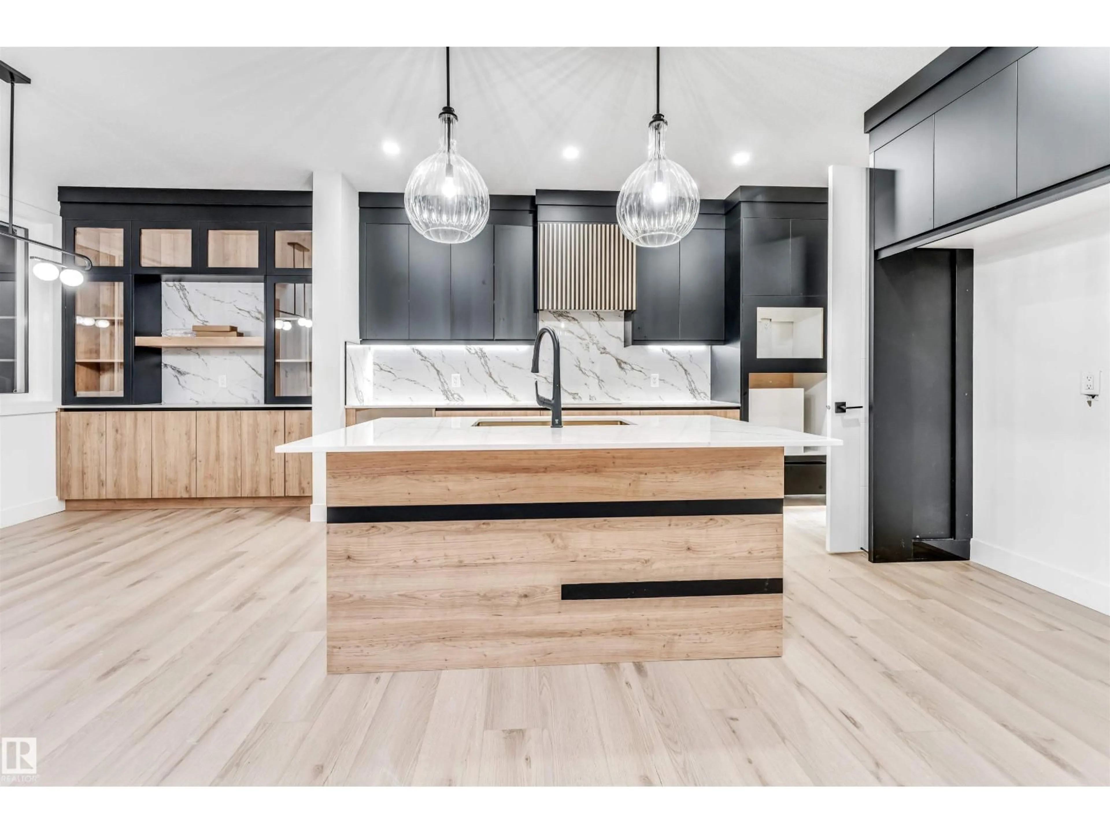 Open concept kitchen, wood/laminate floor for NE - 6310 20 ST, Rural Leduc County Alberta T4X3C9