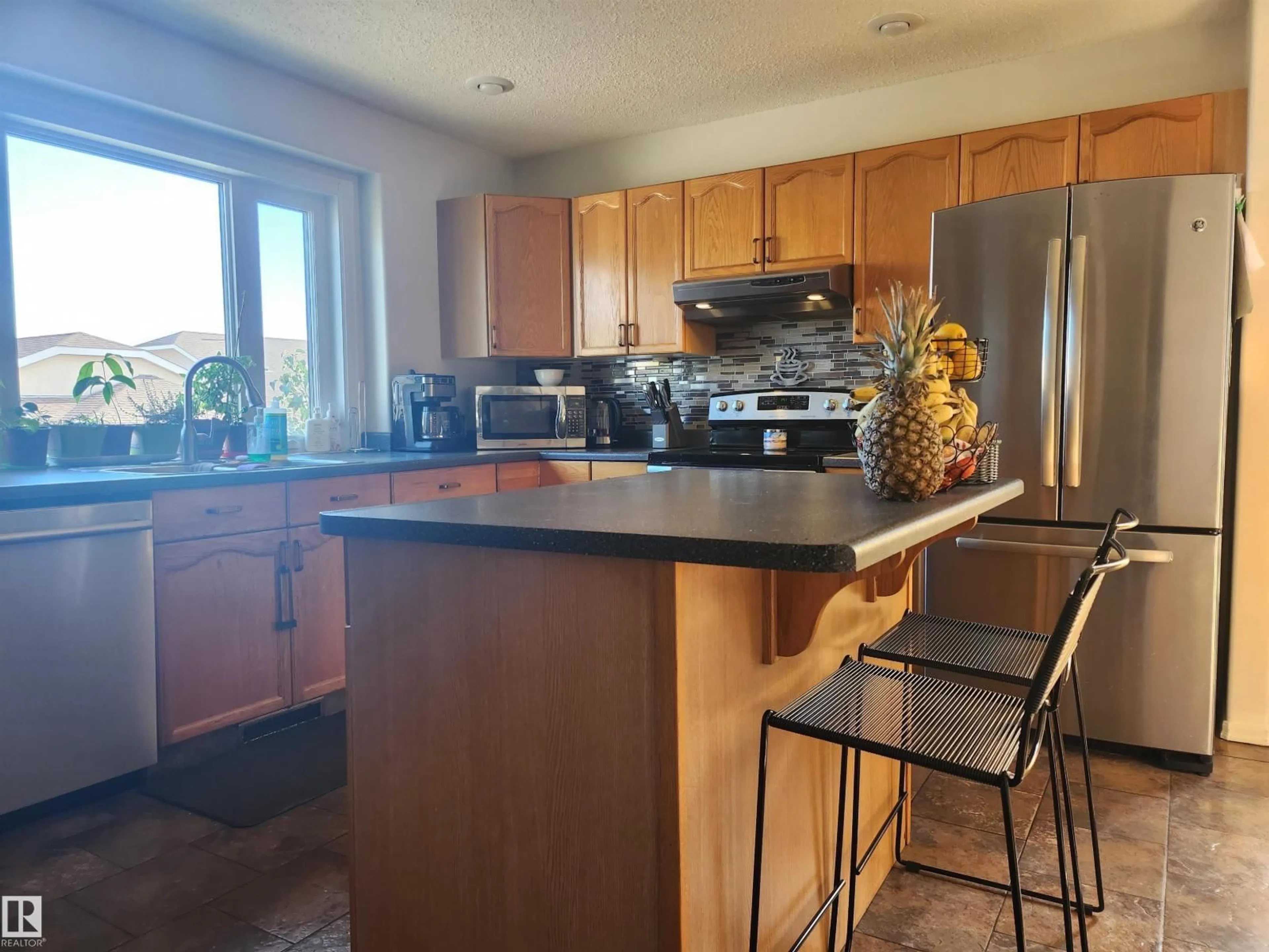 Open concept kitchen, wood/laminate floor for 514 RIVER PT, Edmonton Alberta T5A4Z2