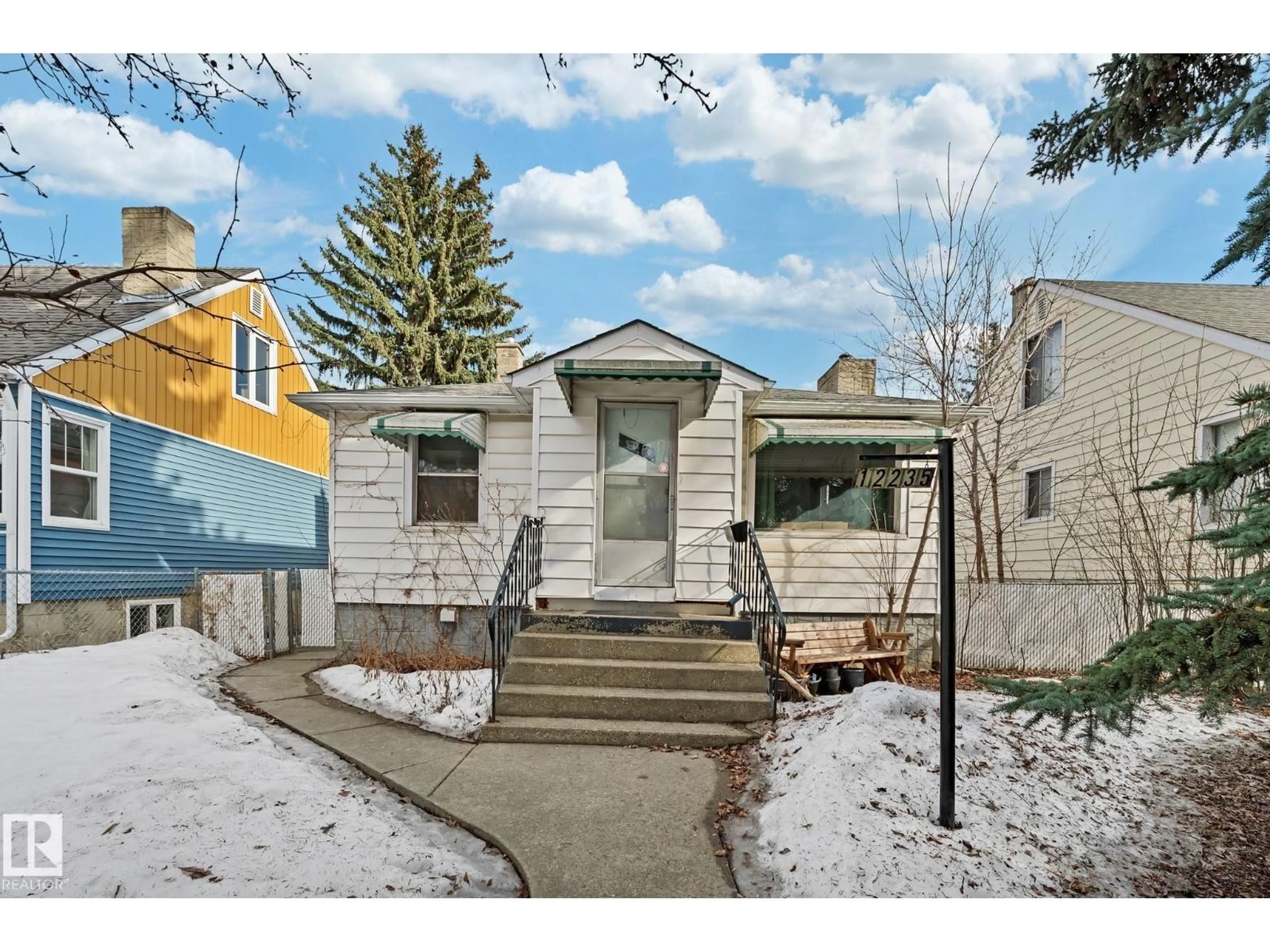 Home with vinyl exterior material, street for NW - 12235 104 ST, Edmonton Alberta T5G2L7