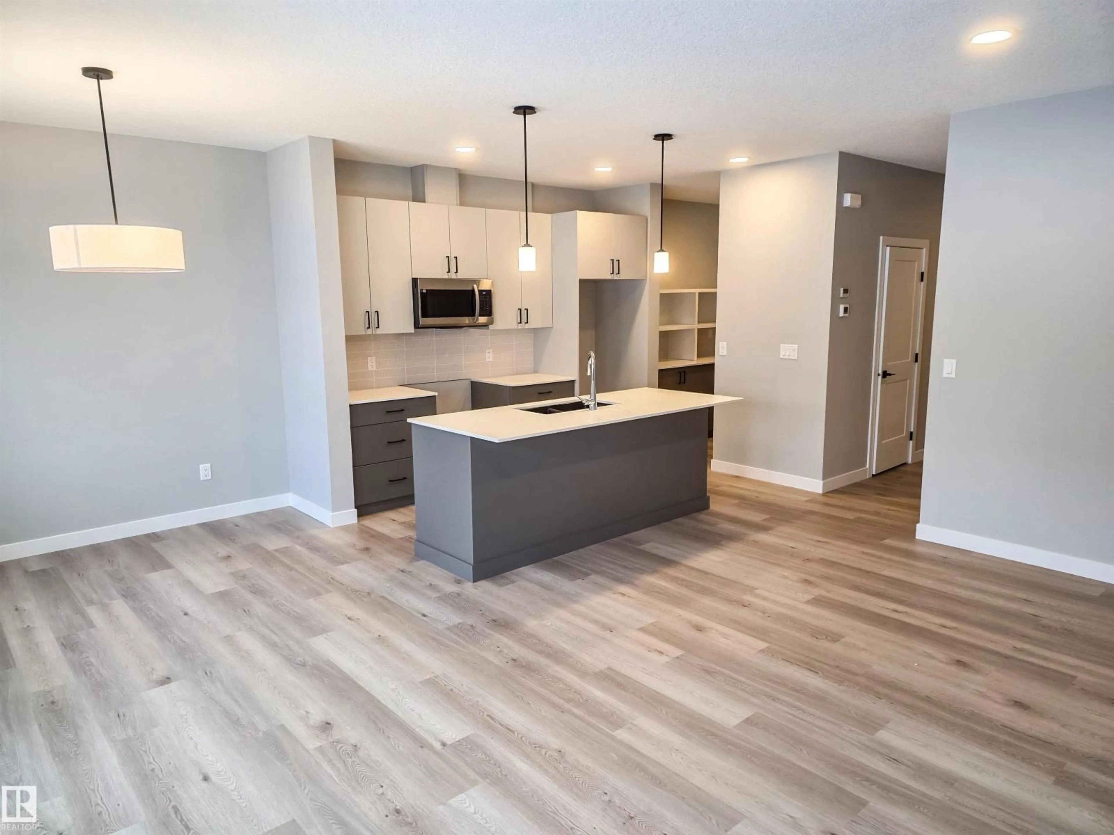 Open concept kitchen, wood/laminate floor for 139 HILTON CV, Spruce Grove Alberta T7X1Y4