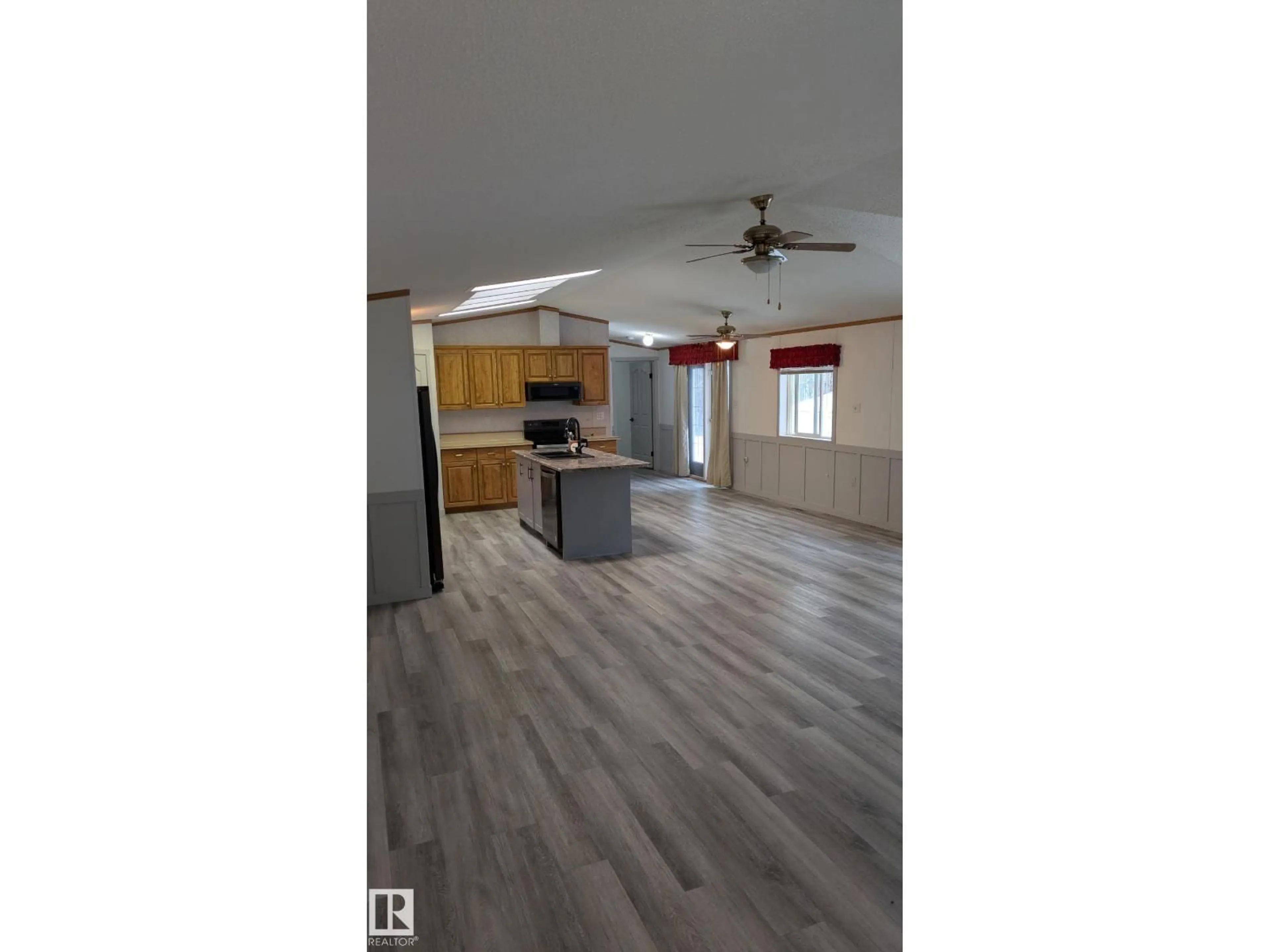 Open concept kitchen, wood/laminate floor for 90 47424 RGE RD 20, Rural Leduc County Alberta T0C2P0