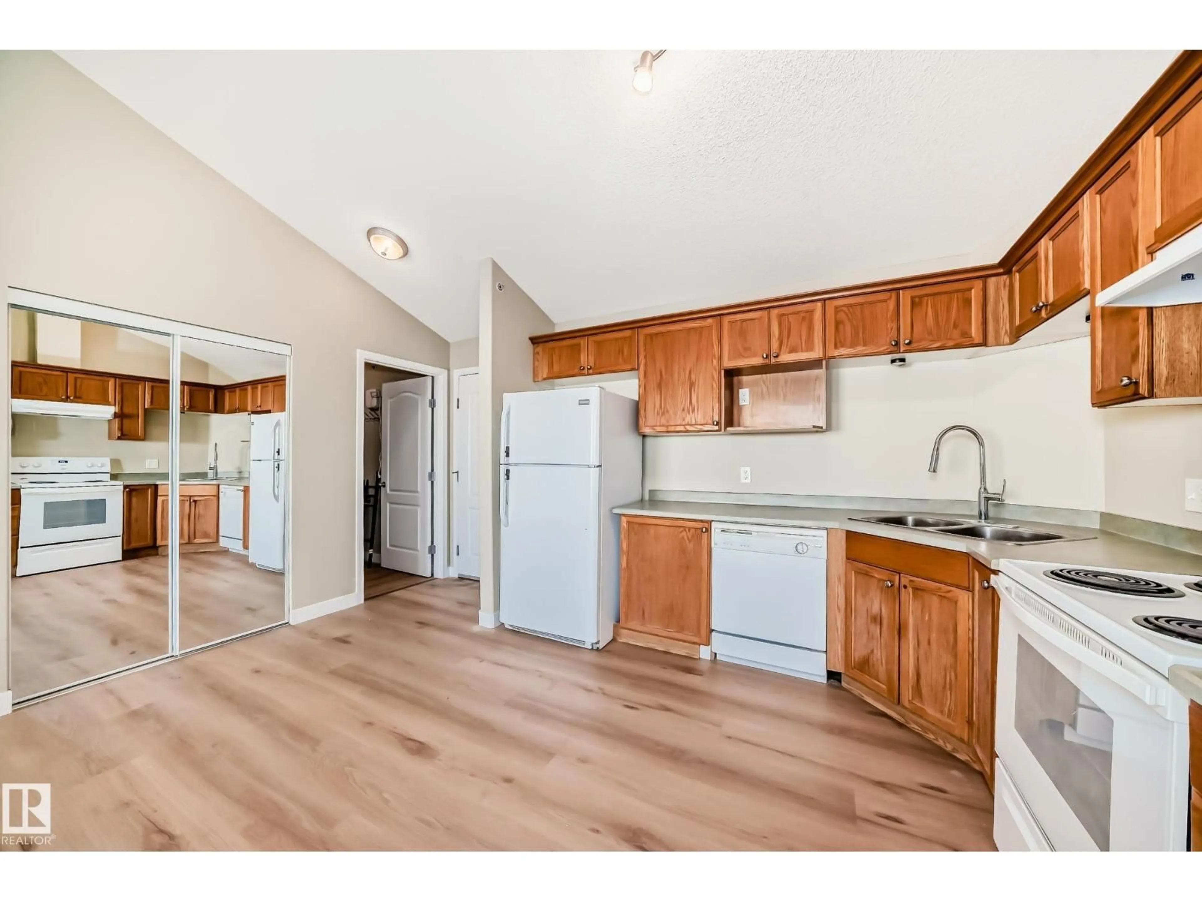 Open concept kitchen, wood/laminate floor for 2422 CLAREVIEW STATION DR, Edmonton Alberta T5Y0E5