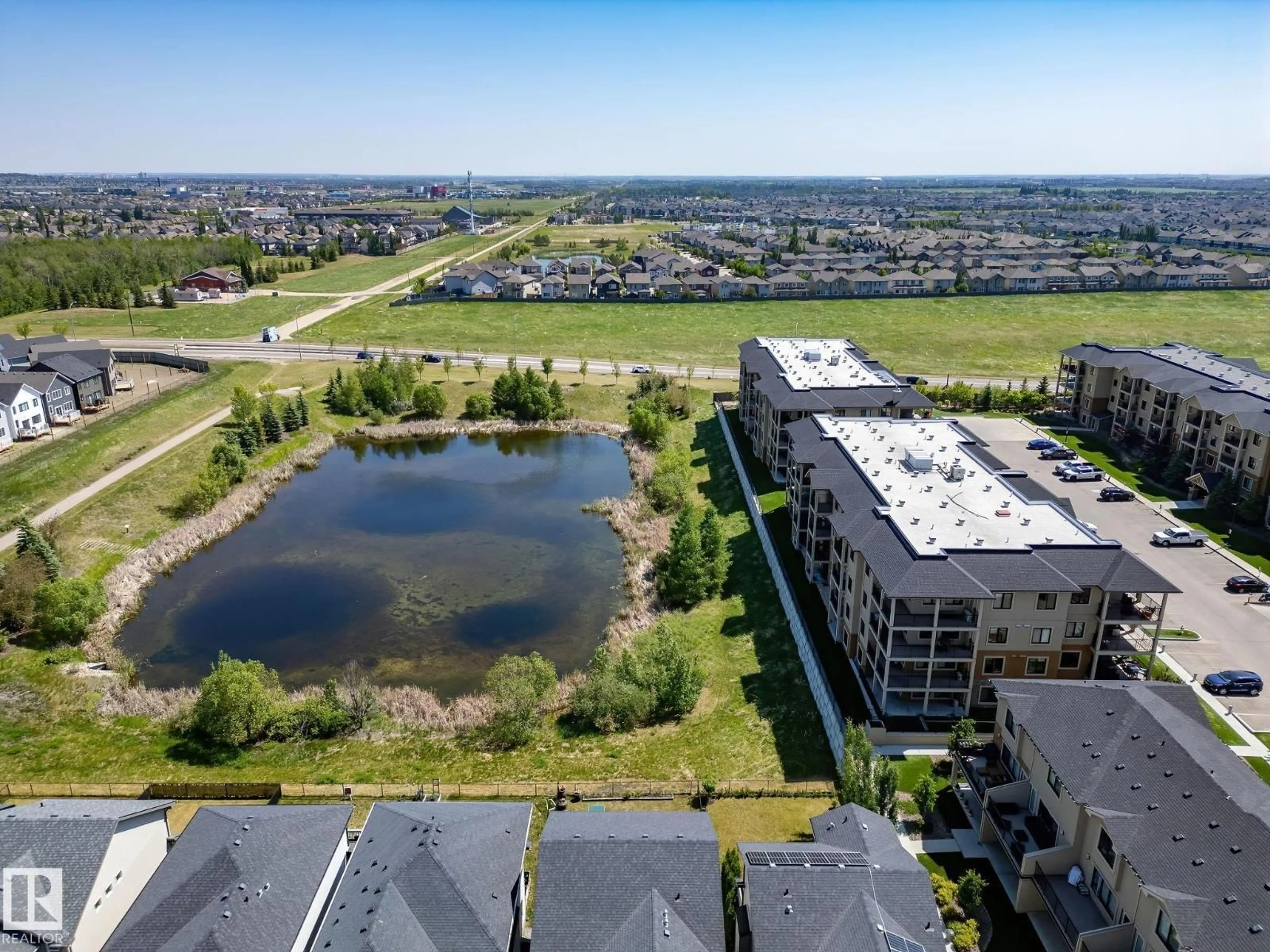 A pic from outside/outdoor area/front of a property/back of a property/a pic from drone, water/lake/river/ocean view for #201 - 1027 173 ST, Edmonton Alberta T6W3E4