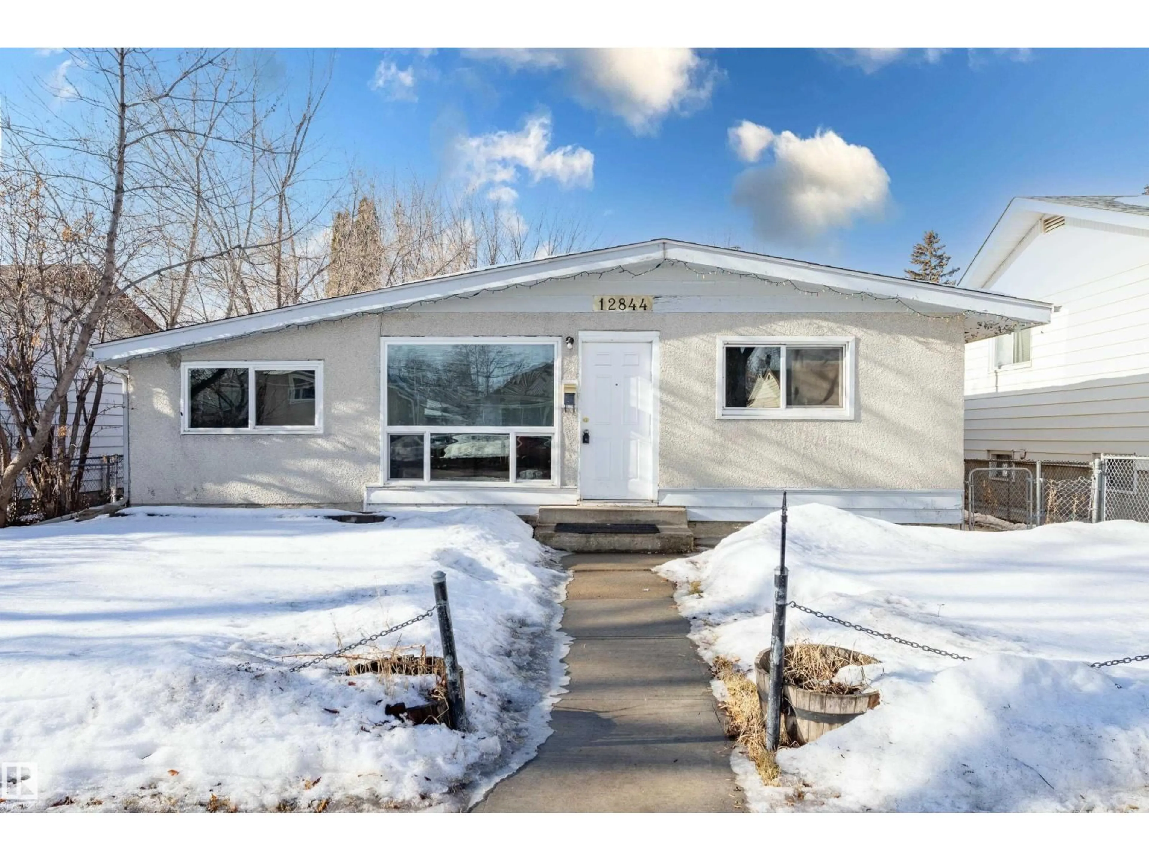 Home with vinyl exterior material, street for NW - 12844 103 ST, Edmonton Alberta T5E4M1