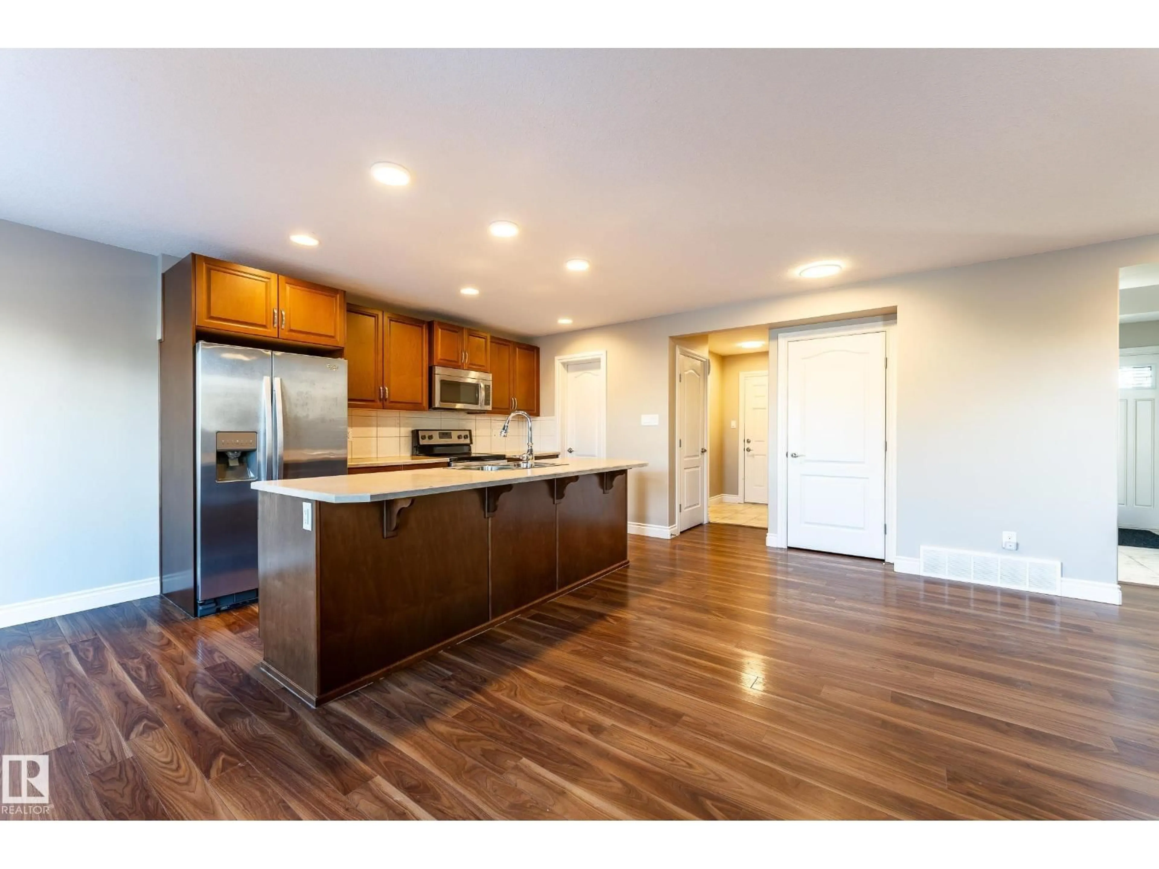 Open concept kitchen, wood/laminate floor for 17614 8 AVENUE SW, Edmonton Alberta T6W2X3