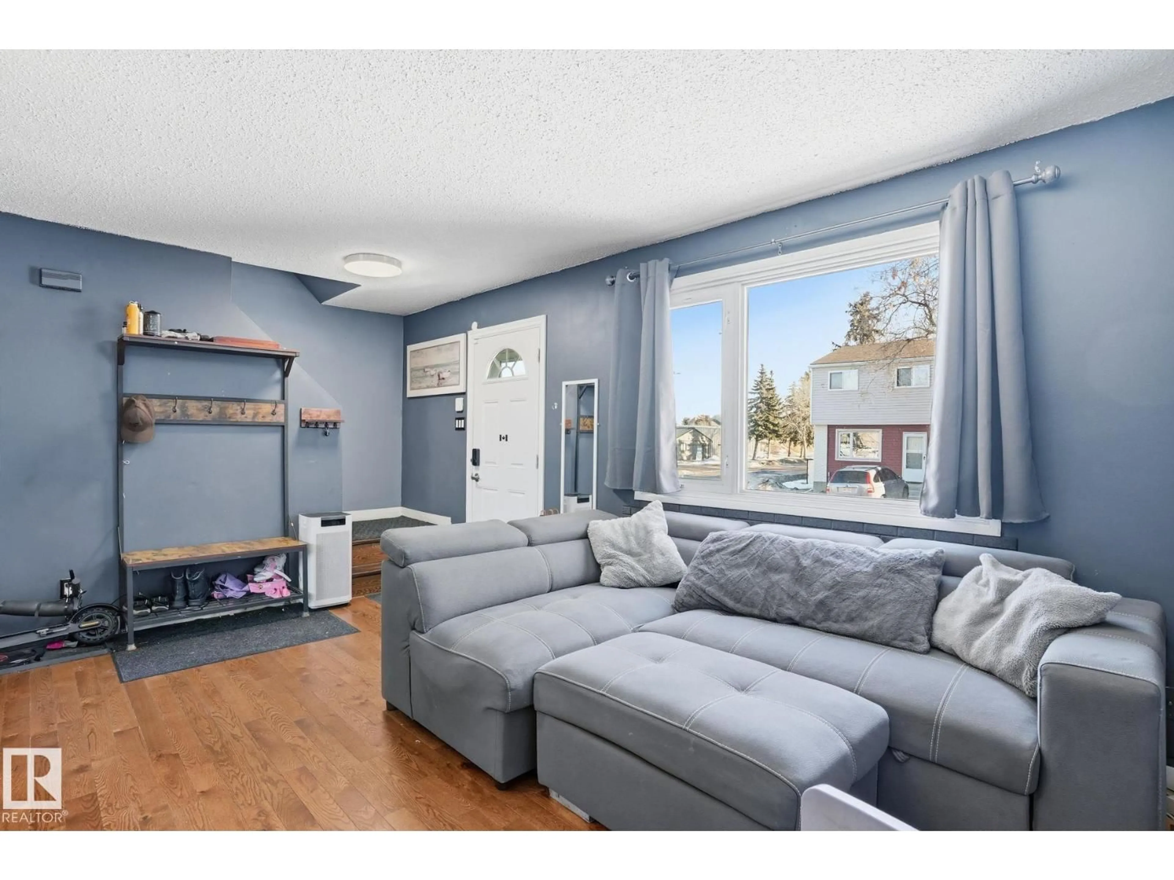 Living room with furniture, wood/laminate floor for 160 HABITAT CR, Edmonton Alberta T5A2X7