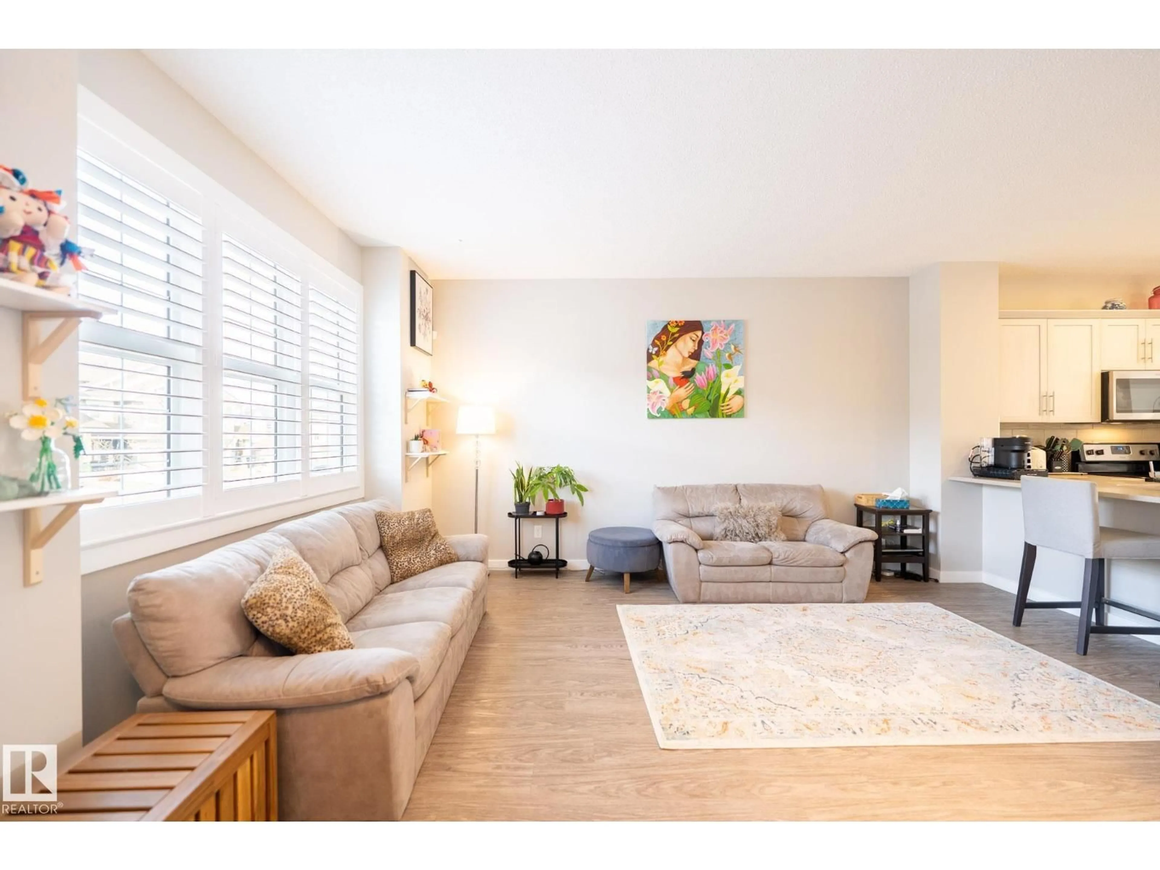 Living room with furniture, wood/laminate floor for SW - 3112 CARPENTER LANDING LD, Edmonton Alberta T6W2Y8