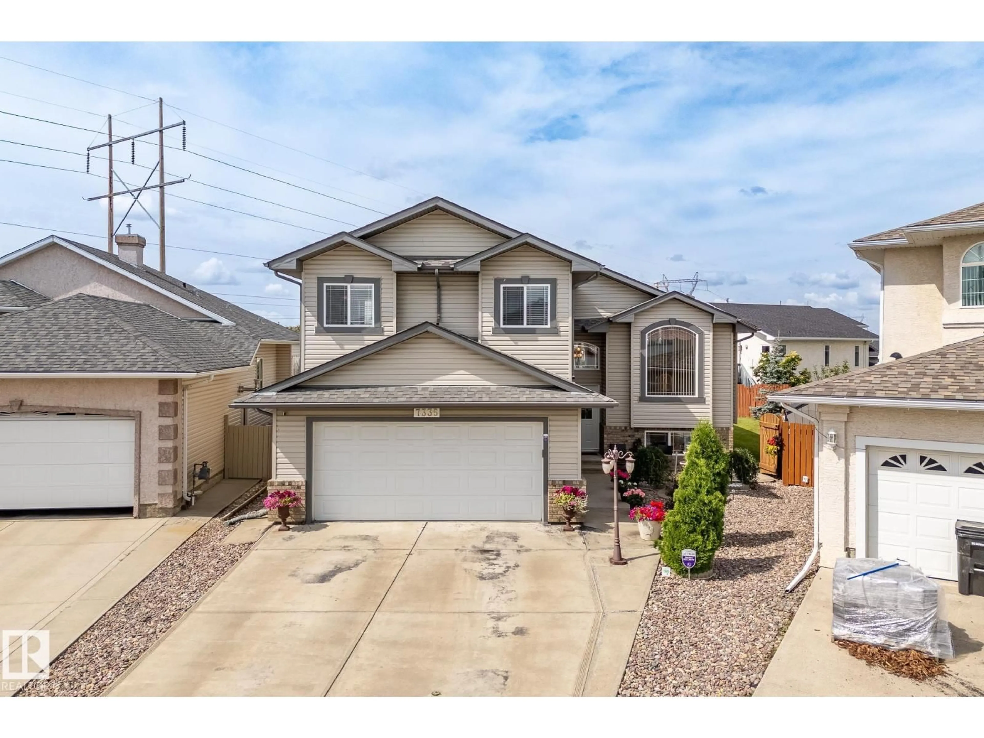 Home with vinyl exterior material, street for 7335 164 AV, Edmonton Alberta T5Z3Y3