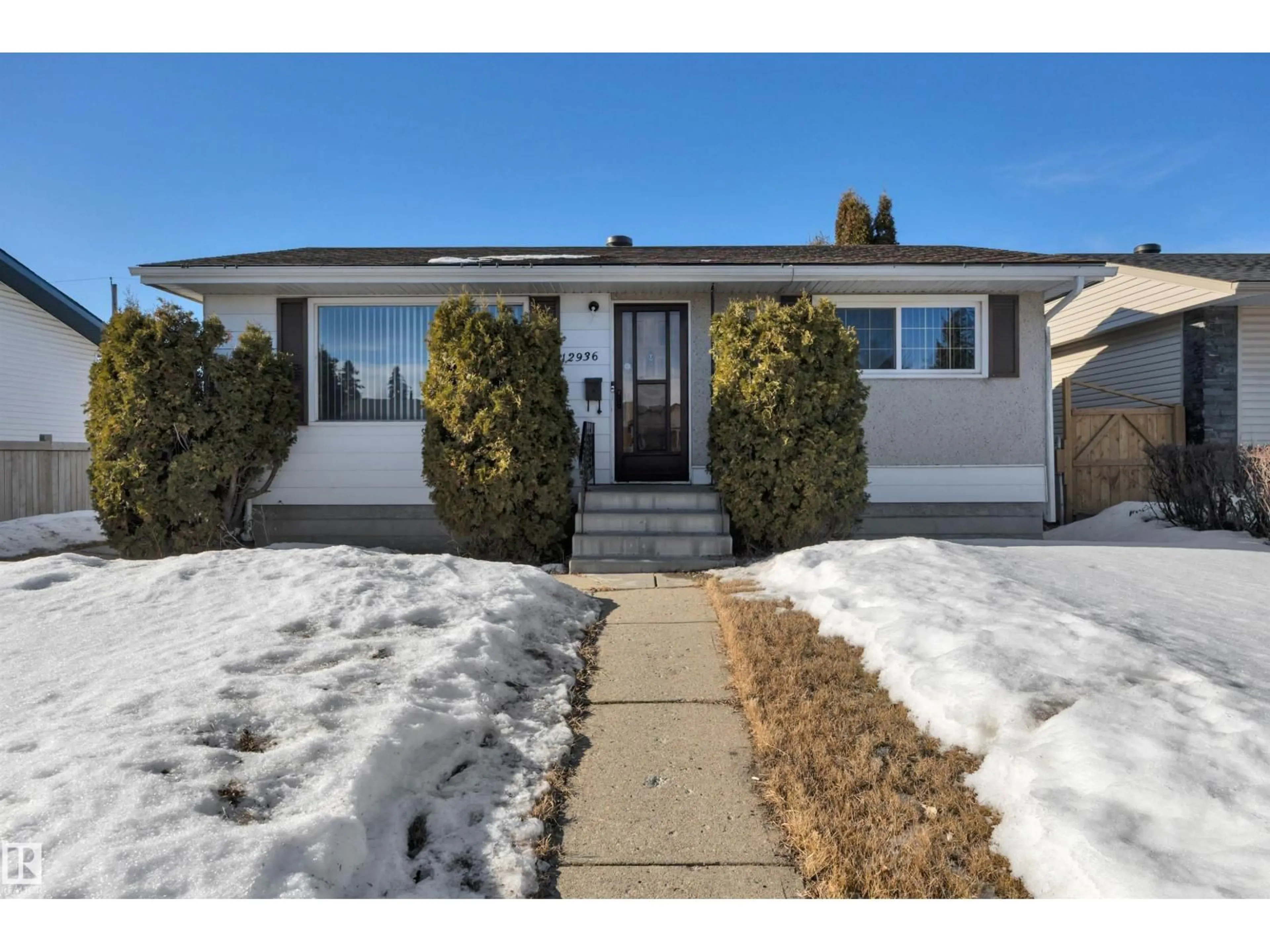 Home with vinyl exterior material, street for NW - 12936 132 ST, Edmonton Alberta T5L1R3