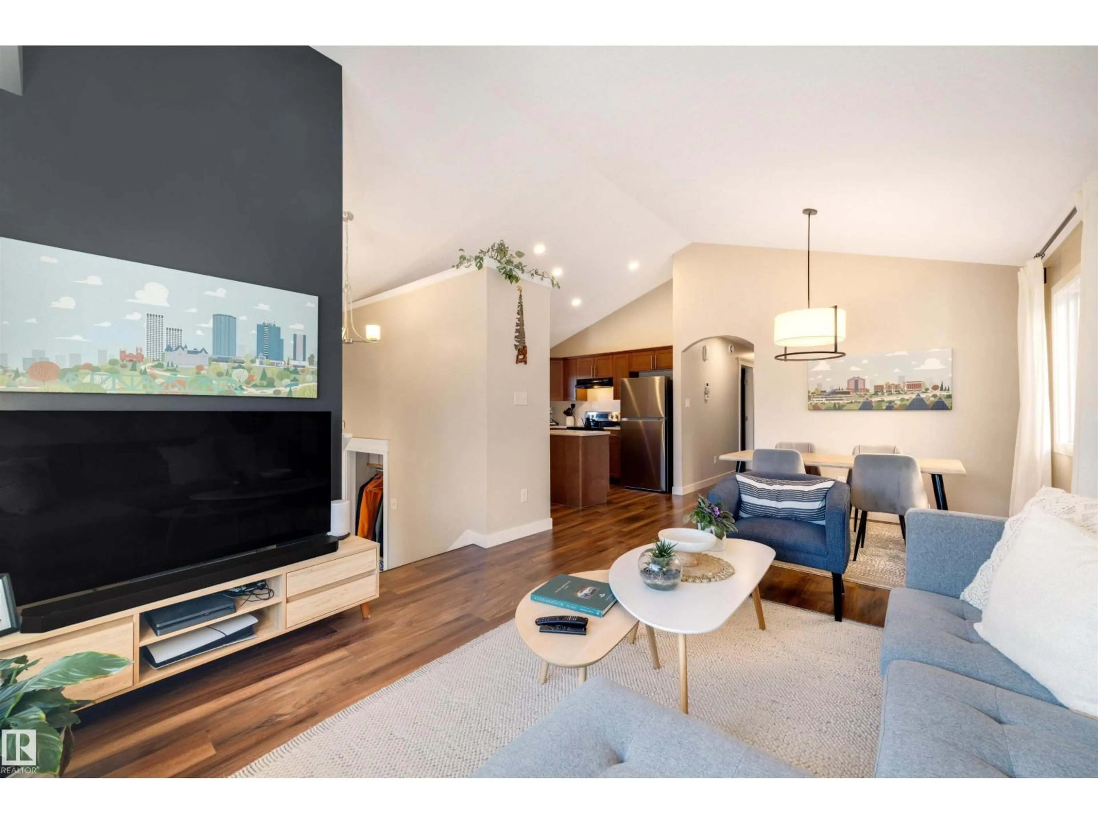 Living room with furniture, wood/laminate floor for 9211 COOPER CR, Edmonton Alberta T6W3L1