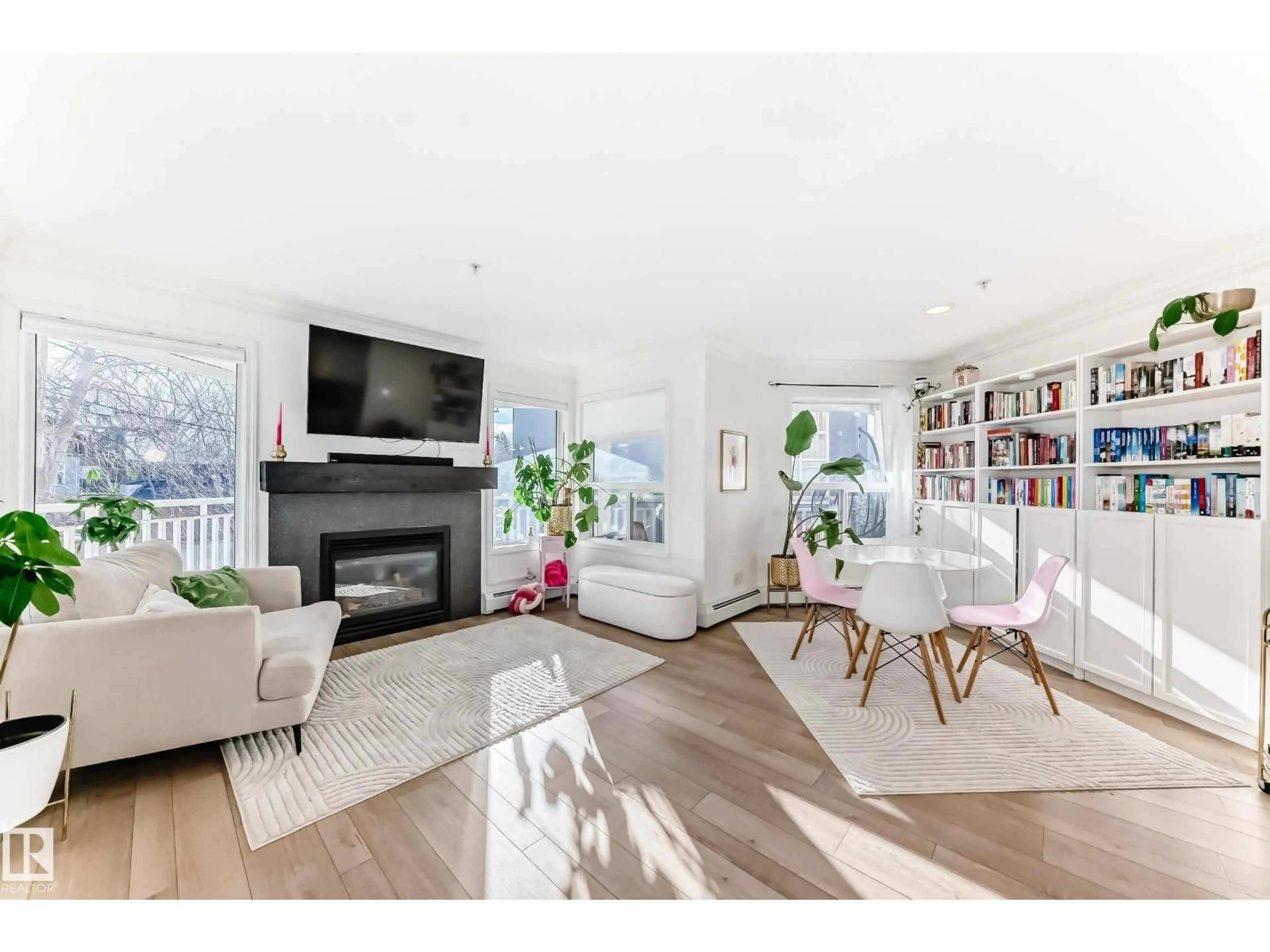 Living room with furniture, wood/laminate floor for 205 - 10933 124 ST, Edmonton Alberta T5M4E1