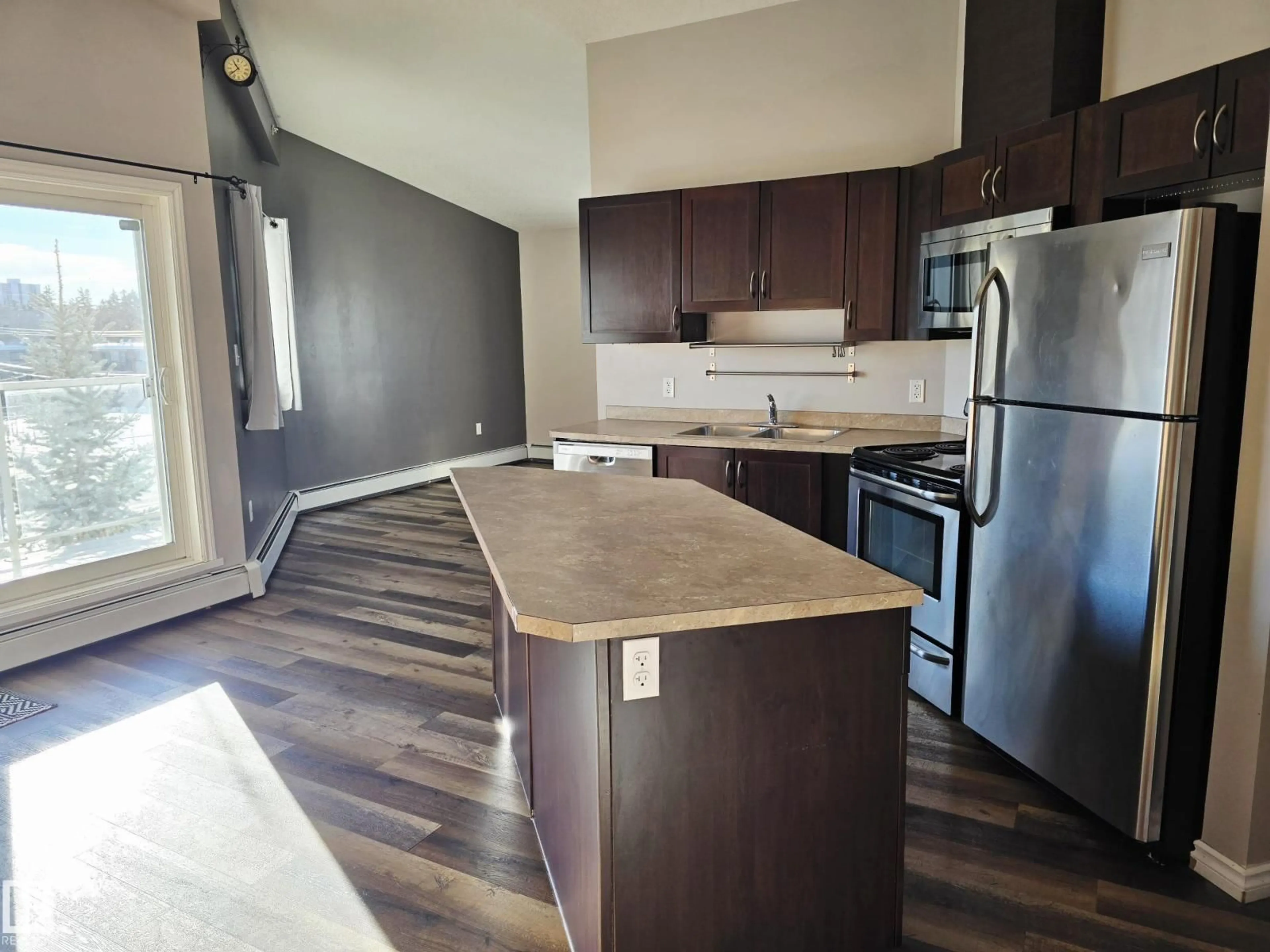 Open concept kitchen, wood/laminate floor for #401 - 10710 116 ST, Edmonton Alberta T5N3A5