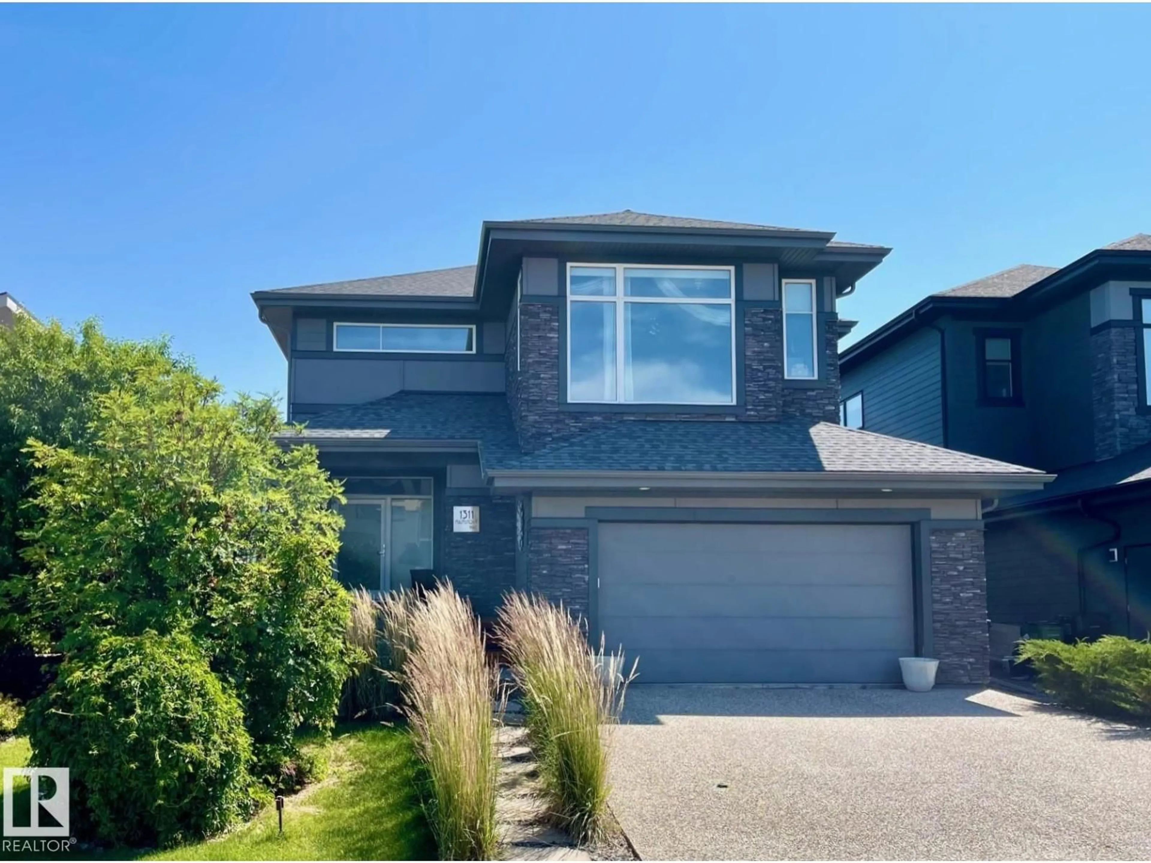 Home with brick exterior material, street for 1311 HAINSTOCK WY, Edmonton Alberta T6W3B6