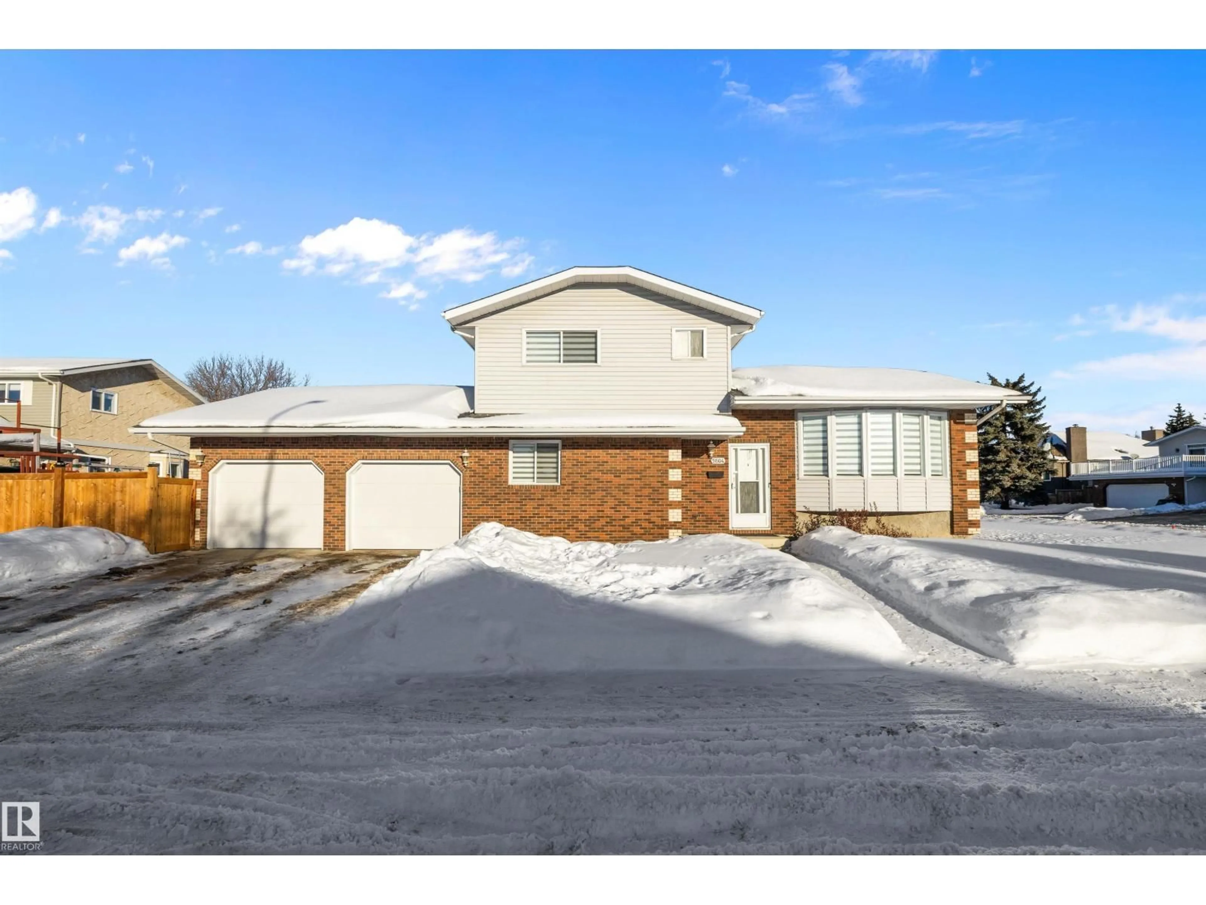 Home with brick exterior material, street for 9804 156 AV, Edmonton Alberta T5X4G8