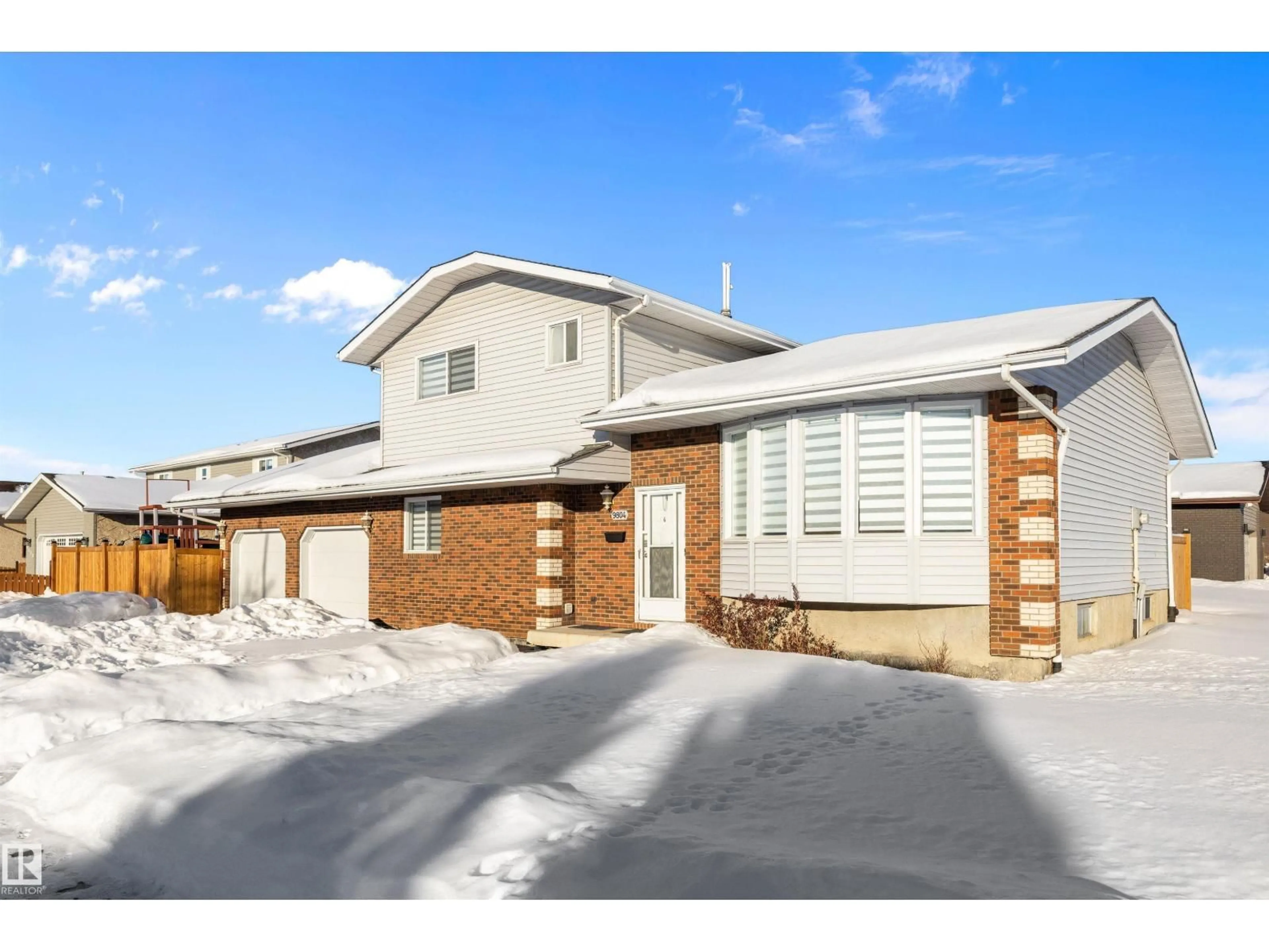 Home with brick exterior material, street for 9804 156 AV, Edmonton Alberta T5X4G8