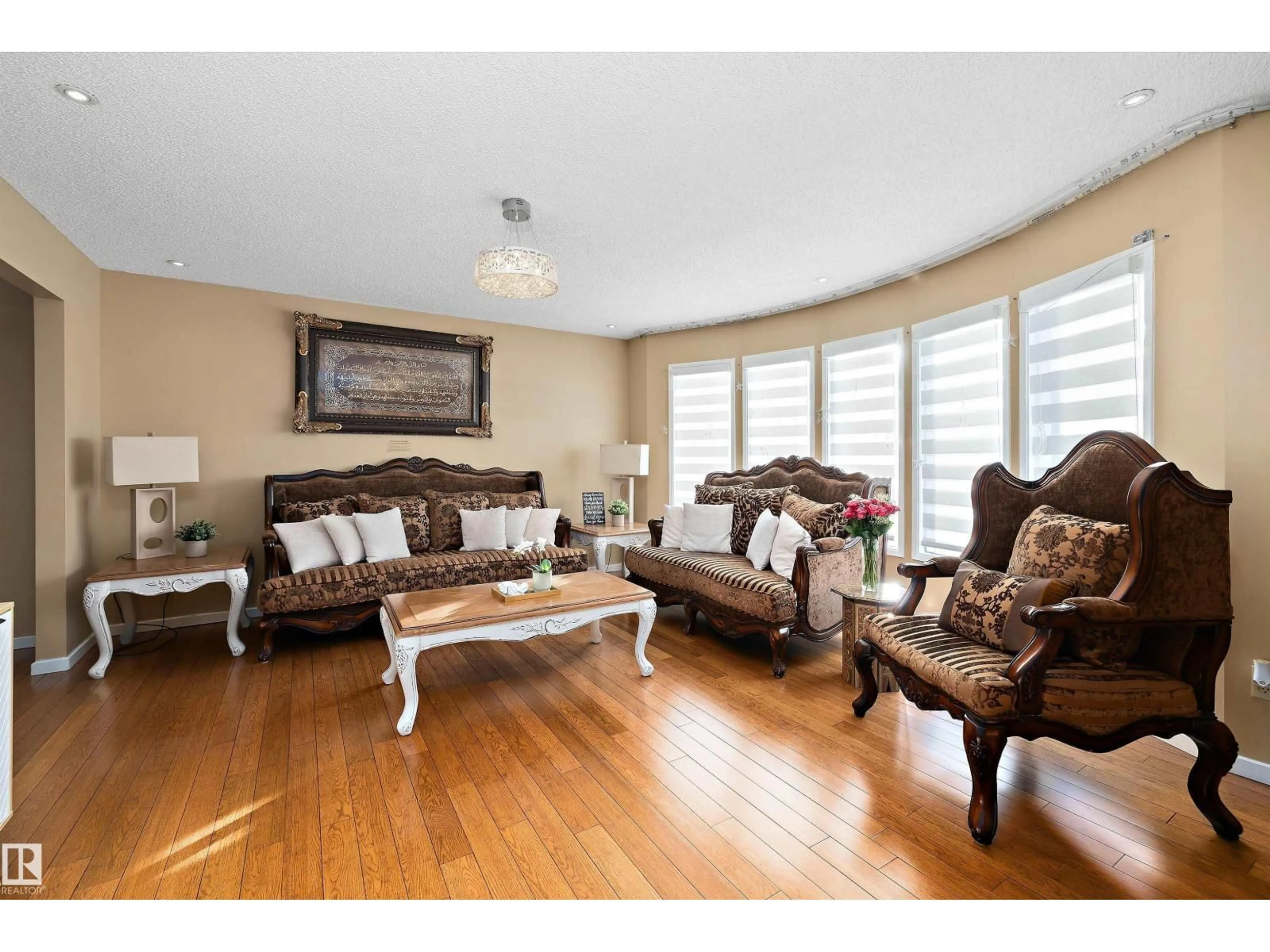 Living room with furniture, wood/laminate floor for 9804 156 AV, Edmonton Alberta T5X4G8