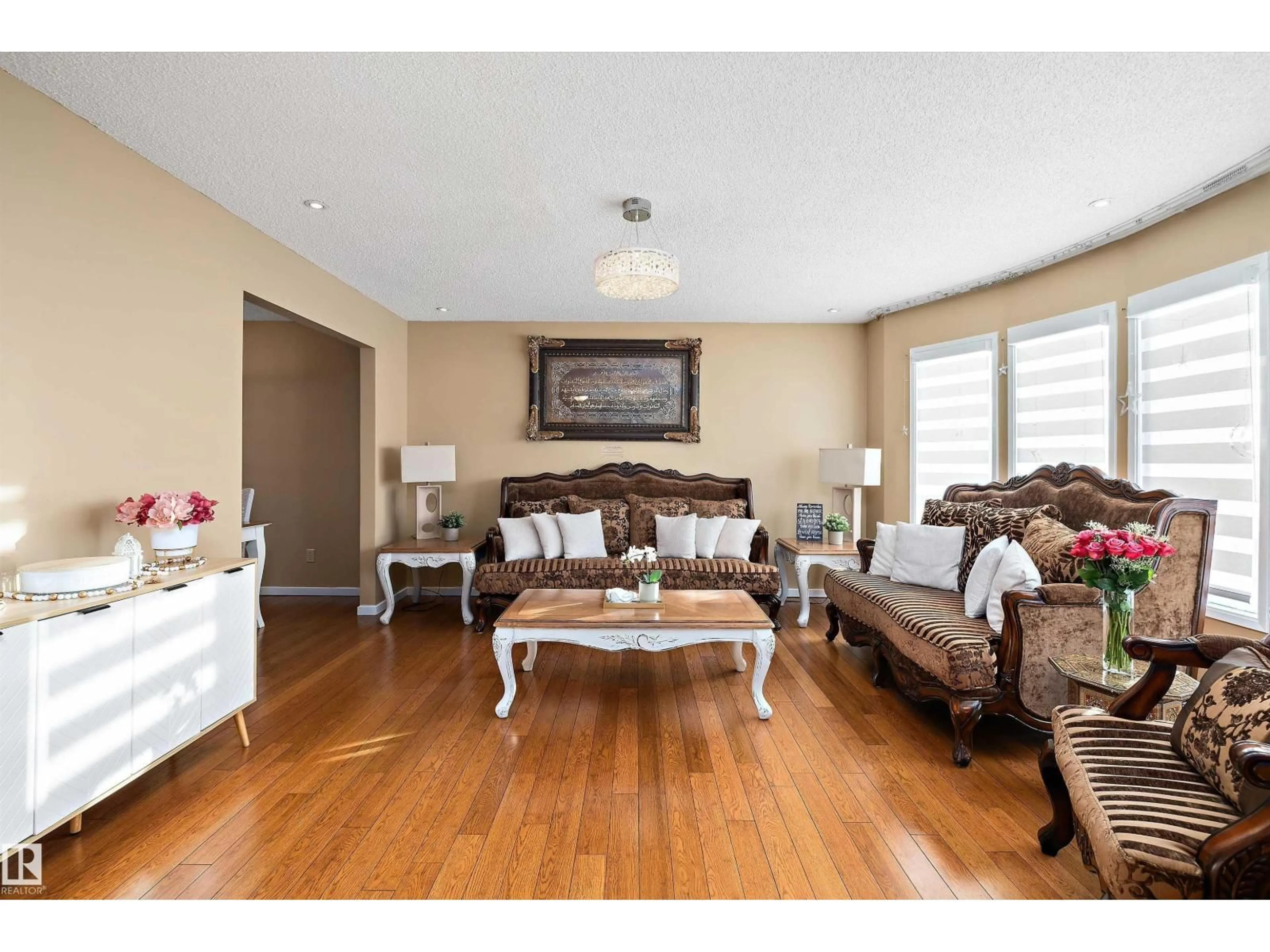 Living room with furniture, wood/laminate floor for 9804 156 AV, Edmonton Alberta T5X4G8