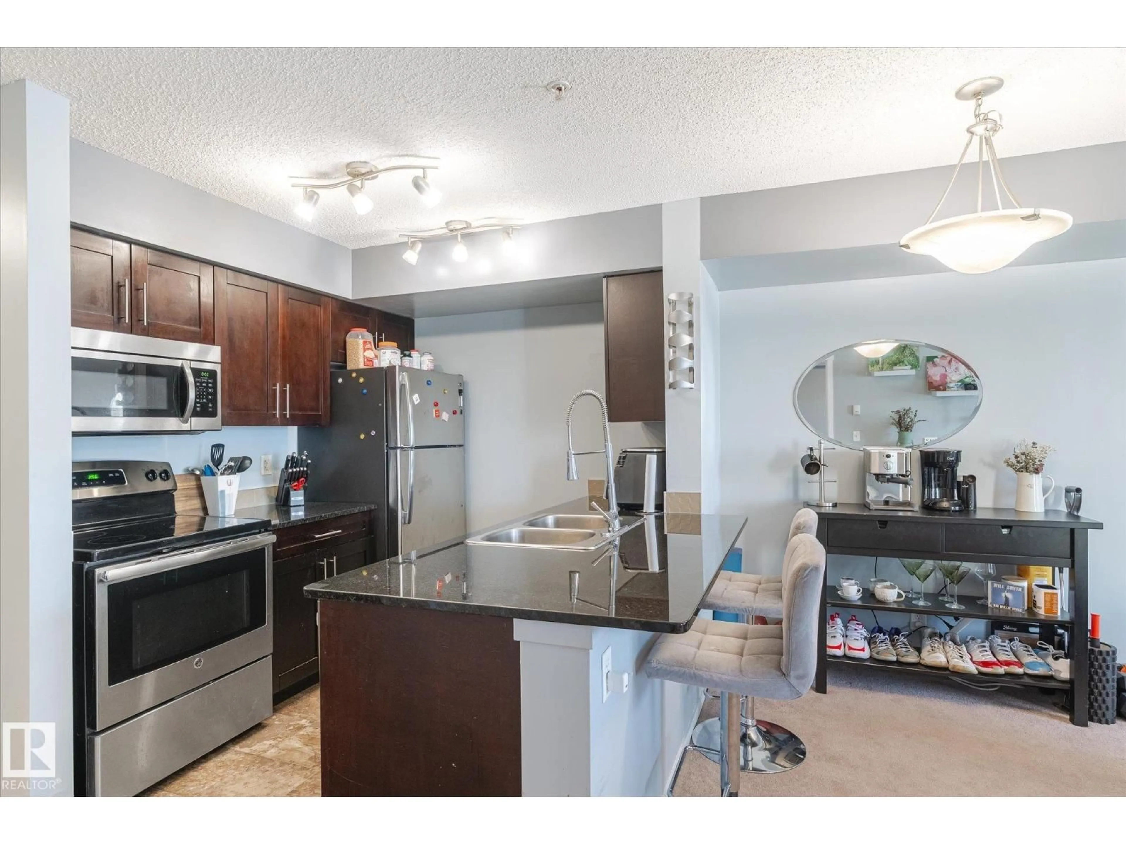 Open concept kitchen, unknown for #115 - 3315 JAMES MOWATT TR, Edmonton Alberta T6W3L9