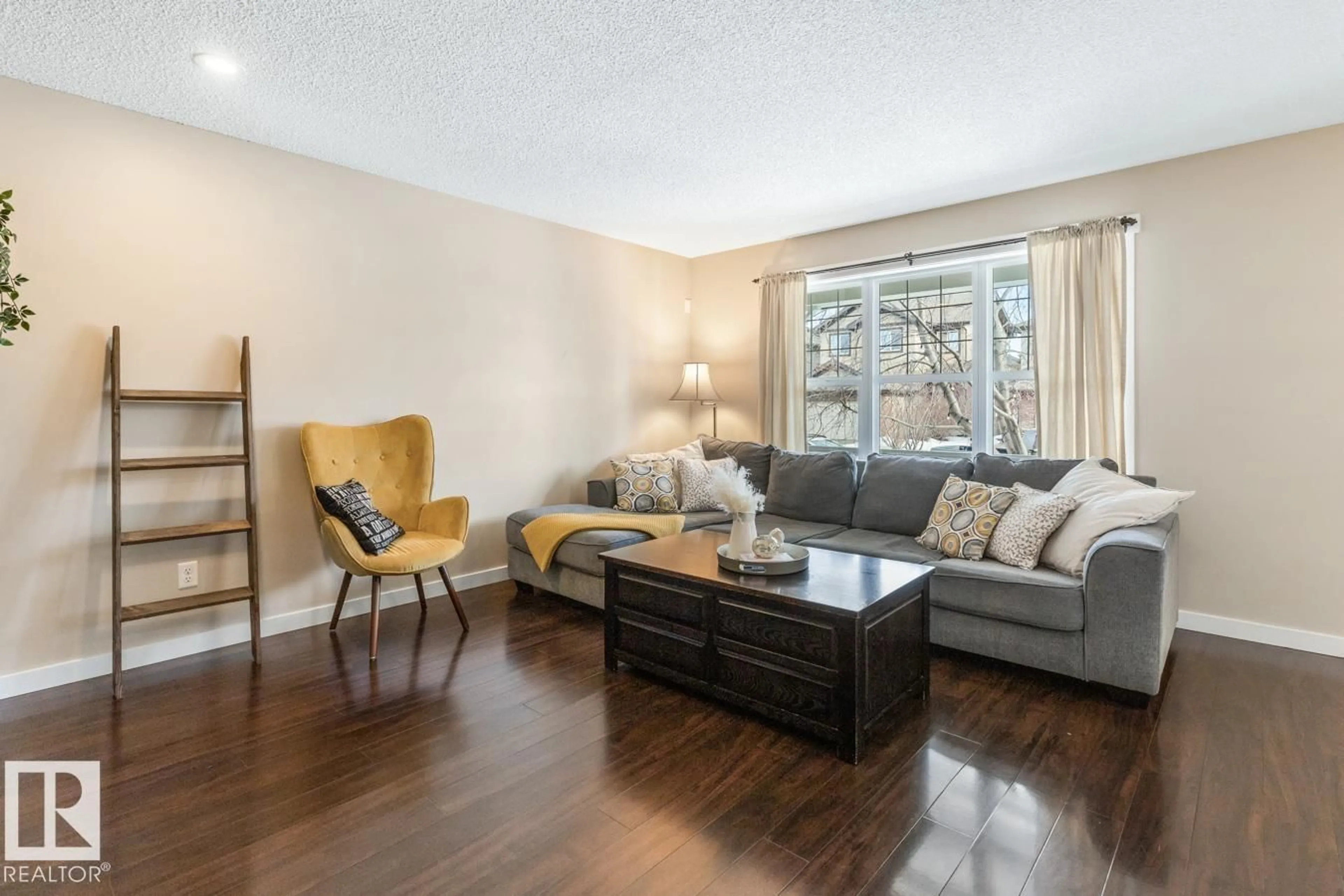 Living room with furniture, wood/laminate floor for 208 57 ST, Edmonton Alberta T6X0K9