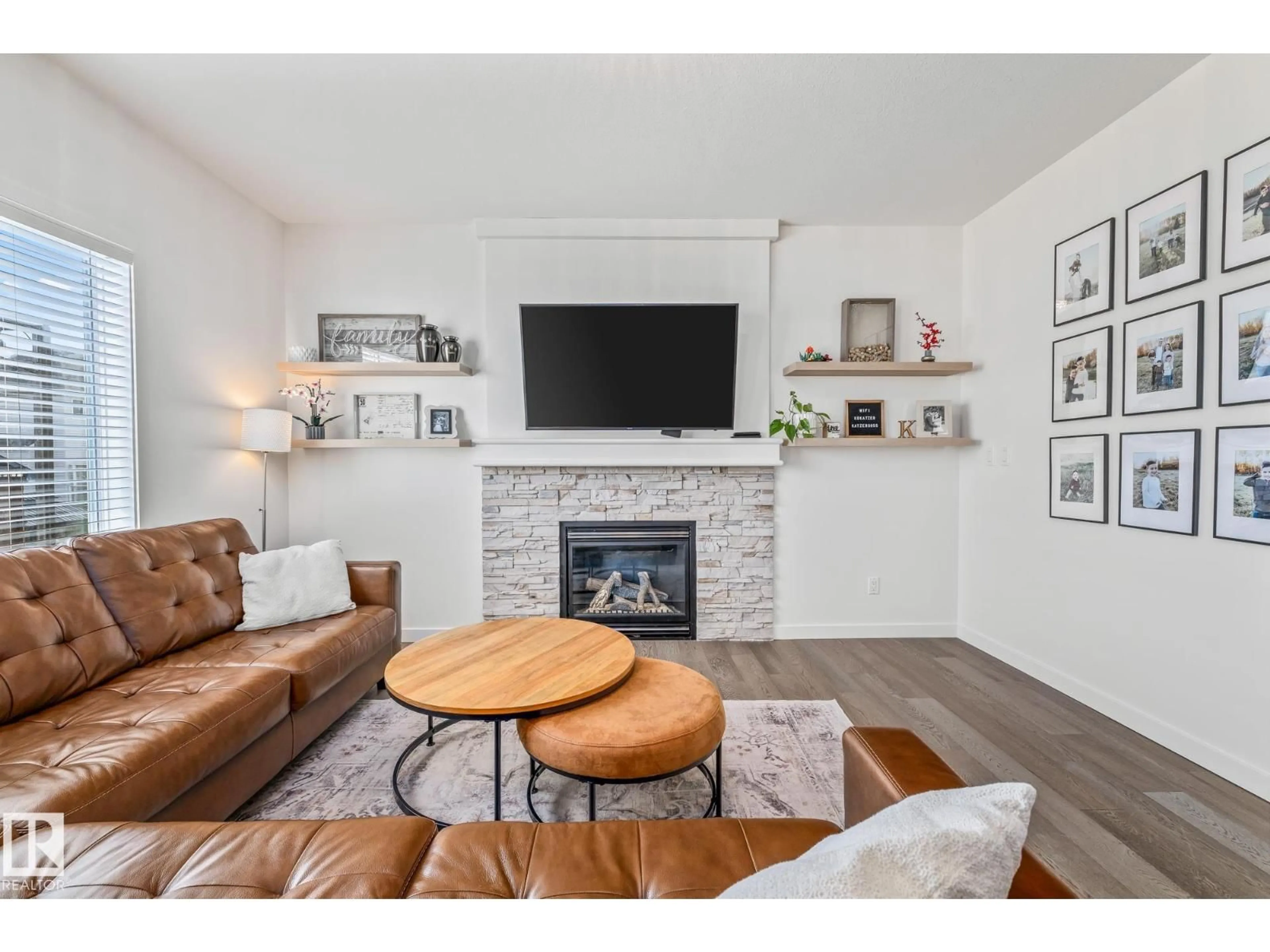 Living room with furniture, wood/laminate floor for 5713 42 ST, Beaumont Alberta T4X0C2