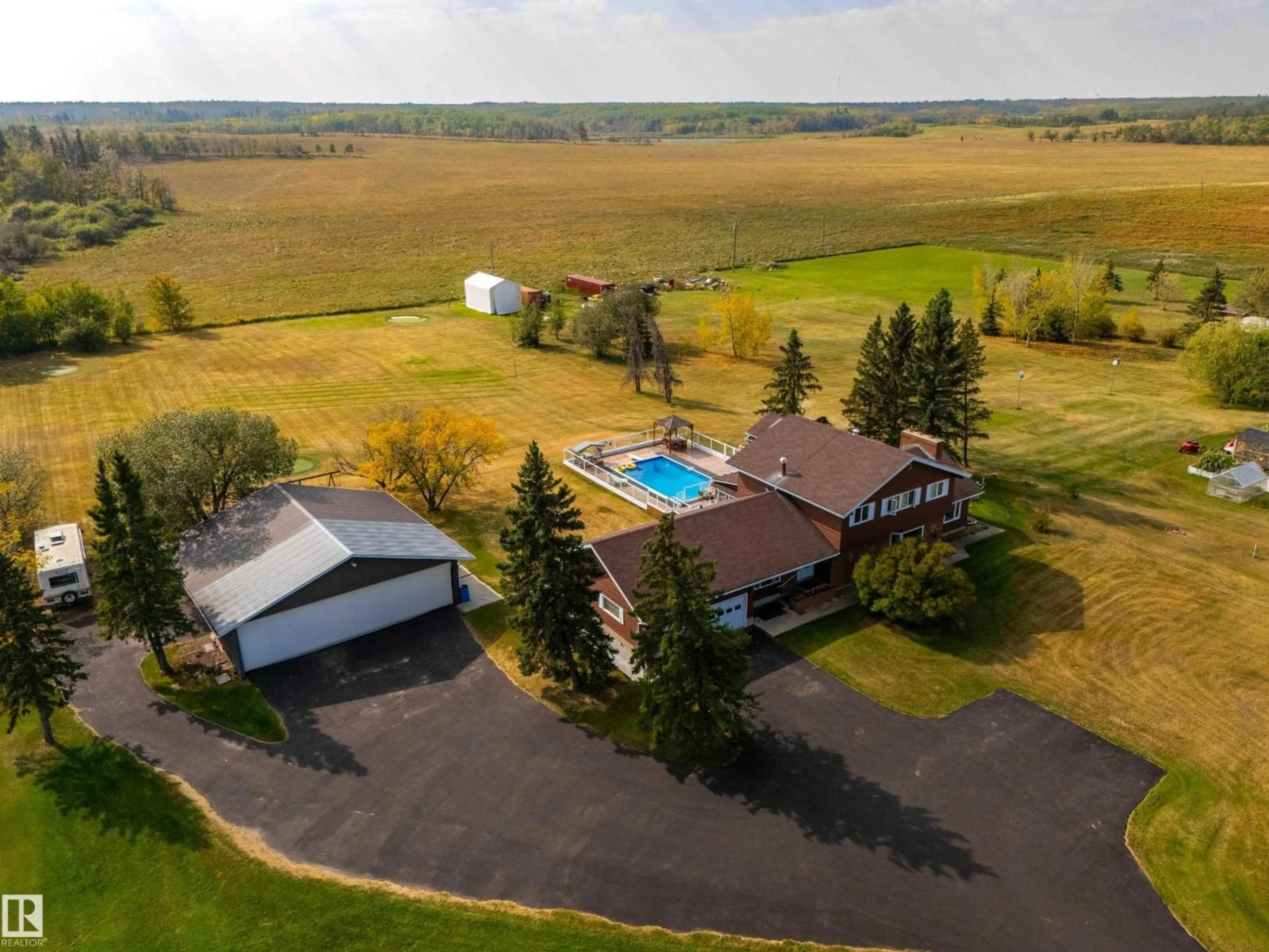 A pic from outside/outdoor area/front of a property/back of a property/a pic from drone, unknown for 73 52112 RGE ROAD 222, Rural Strathcona County Alberta T8C1H6