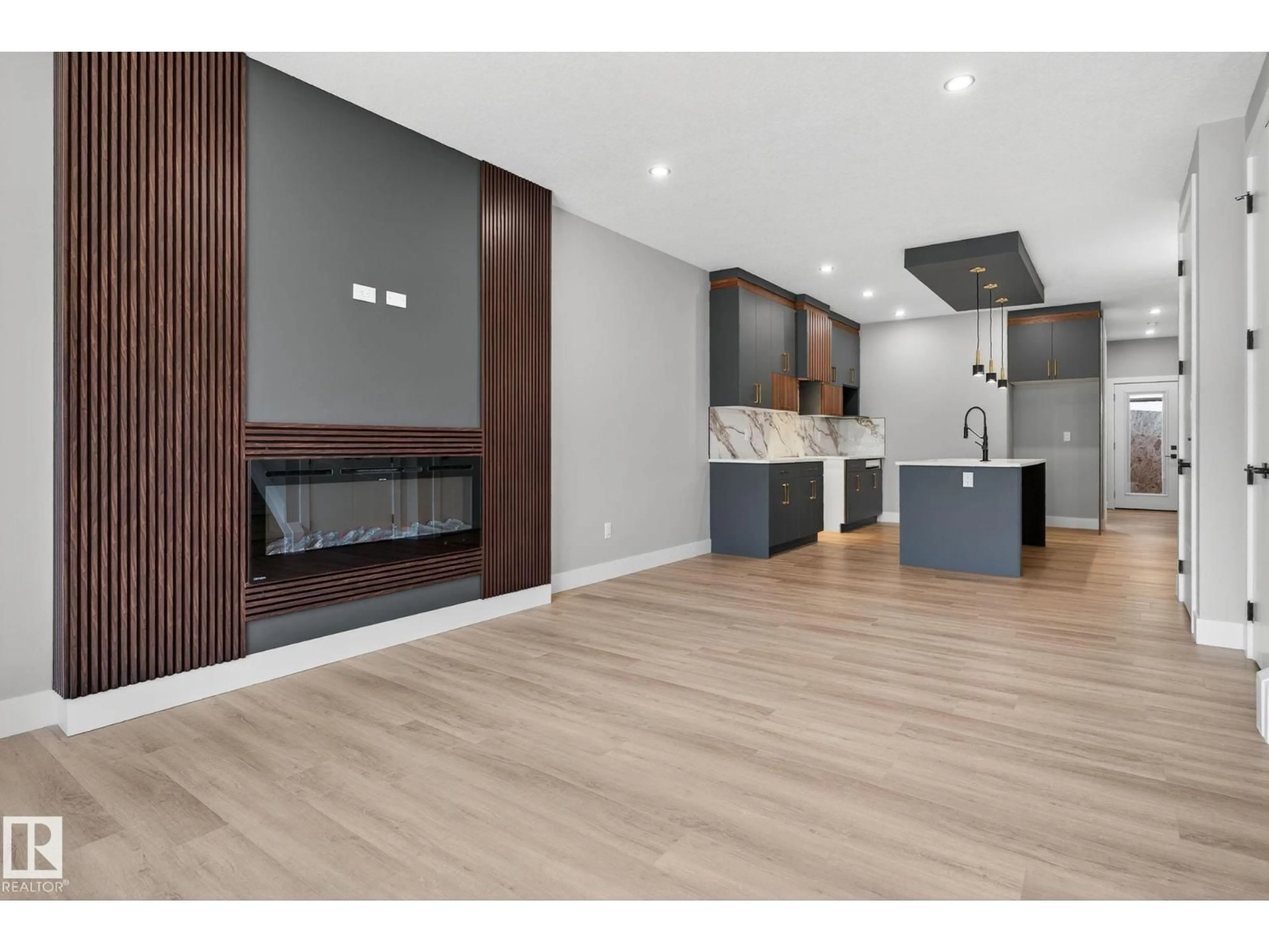 Open concept kitchen, wood/laminate floor for 456 CRYSTAL CREEK LI, Leduc Alberta T9E0X5
