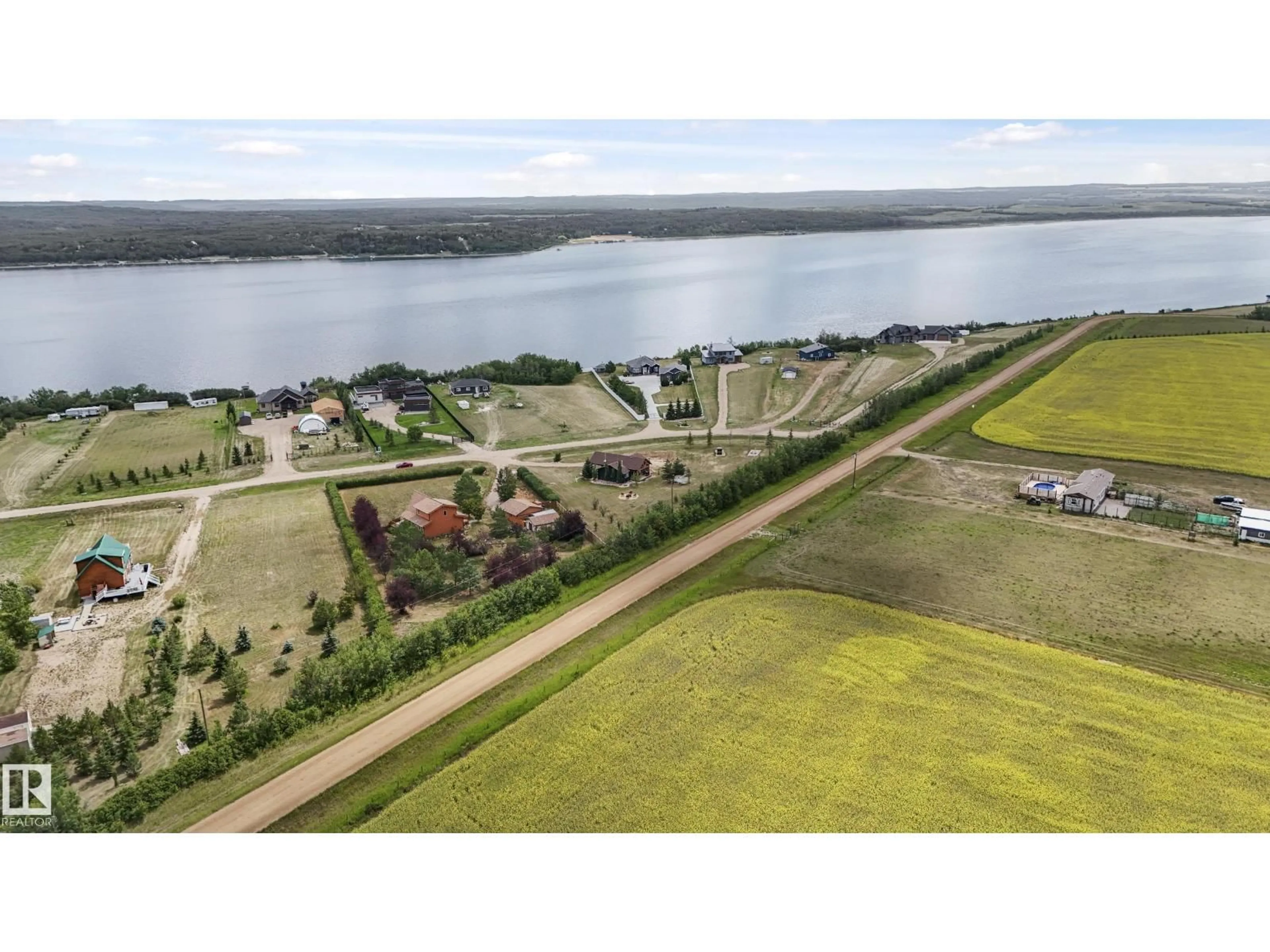 A pic from outside/outdoor area/front of a property/back of a property/a pic from drone, water/lake/river/ocean view for 562115 - 118 RR 114, Rural Two Hills County Alberta T0B4K0